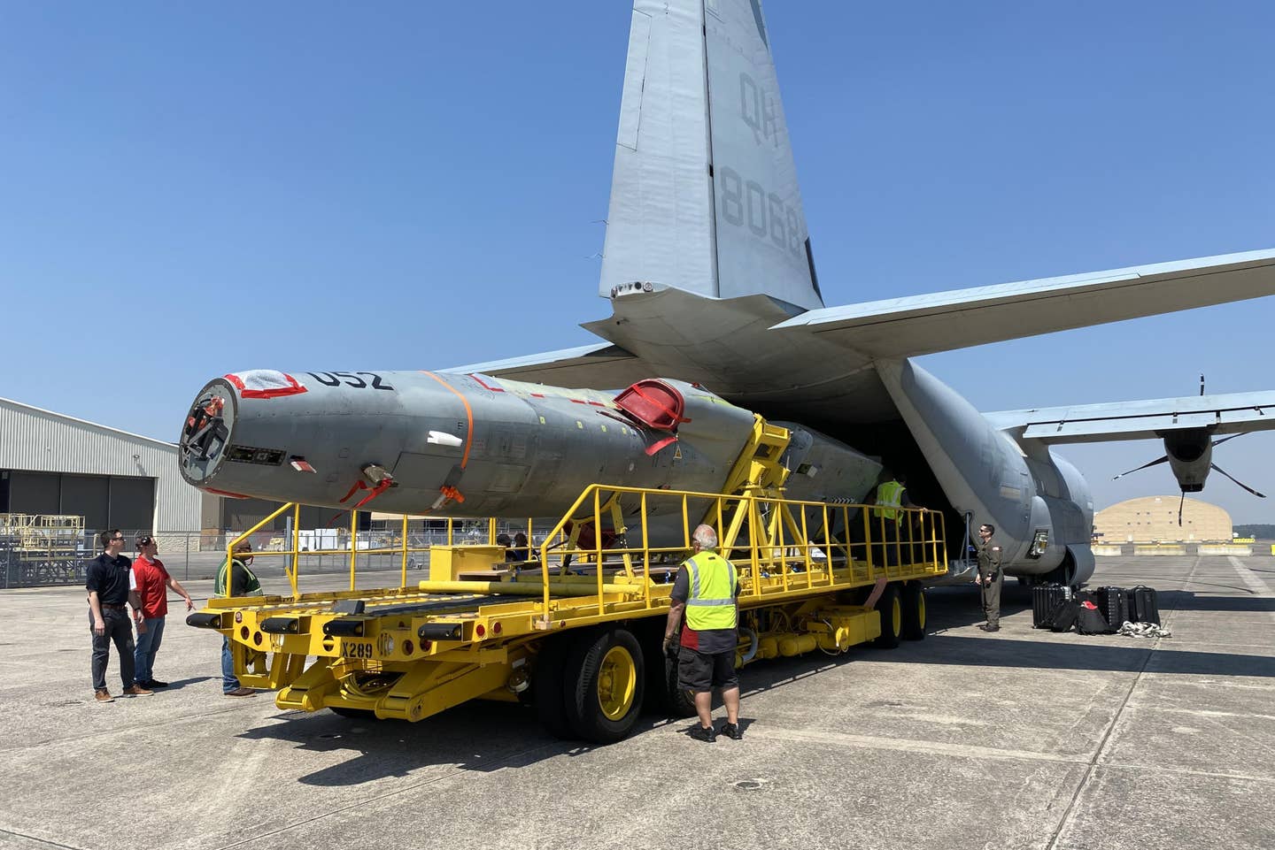 The fuselage of the ex-Swiss F-5E is off-loaded from a US Marine Corps KC-130J Hercules at Cecil Field on March 21, 2024. <em>USN</em>