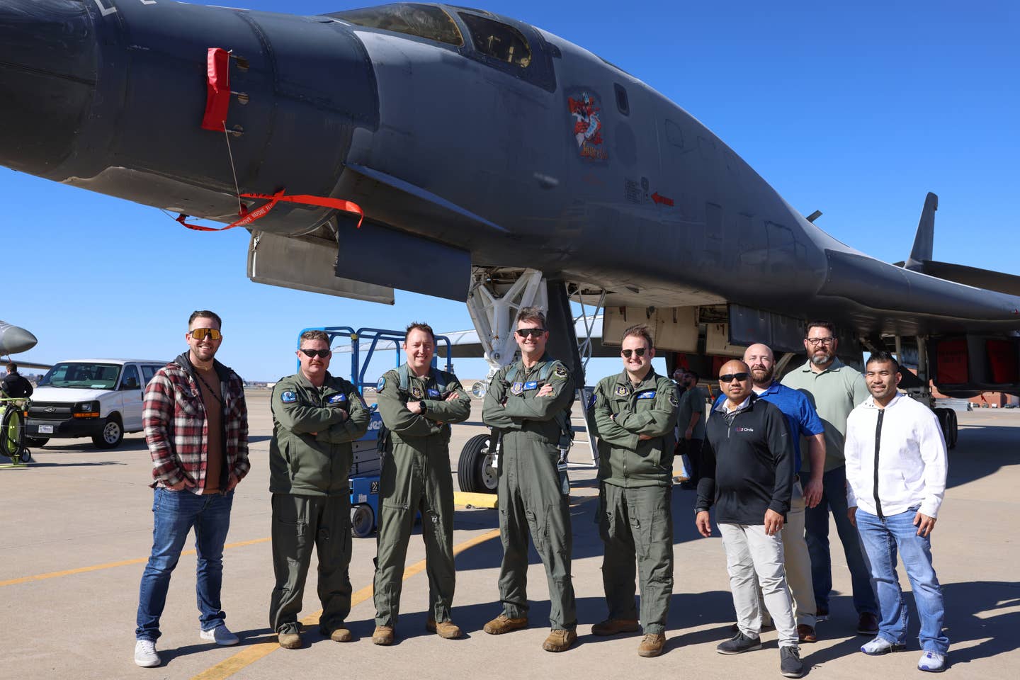 Members of the 10th Flight Test Squadron and the B-1 System Program Office pose in front of B-1B <em>Lancelot</em>, at Tinker Air Force Base, Oklahoma, February 8, 2024. Members of the 10th FLTS flew “Lancelot” to Tinker from Davis-Monthan AFB, Arizona, where the aircraft had previously been retired at the 309th Aerospace Maintenance and Regeneration Group for almost three years. <em>U.S. Air Force photo by Paul Shirk</em><br>