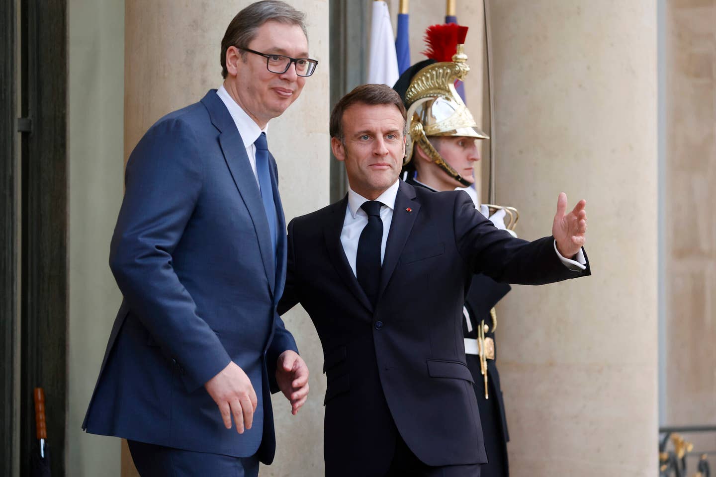 French President Emmanuel Macron (right) welcomes Serbian President Aleksandar Vucic prior to a working dinner at the presidential Elysee Palace on April 8, 2024 in Paris, France. <em>Photo by Chesnot/Getty Images</em>