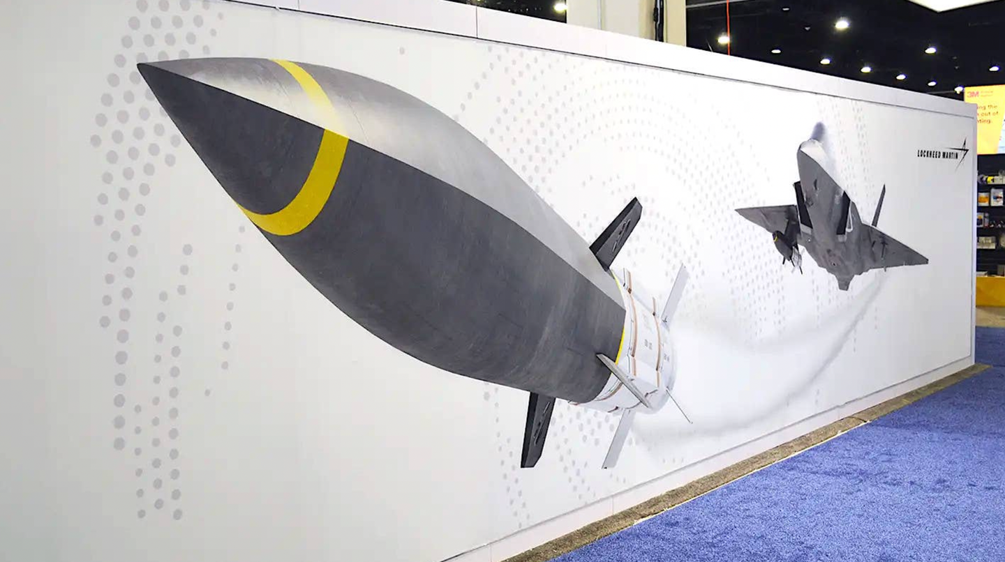 Lockheed Martin artwork depicting an F-35C launching a hypersonic cruise missile from an external pylon, with another still under its wing.&nbsp;<em>Joseph Trevithick</em>