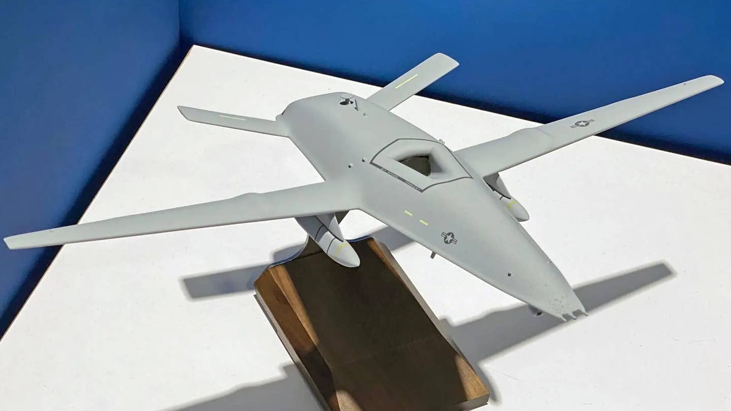A Boeing model depicting an MQ-25 armed with a pair of AGM-158C Long Range Anti-Ship Missiles (LRASM). <em>Jamie Hunter</em>