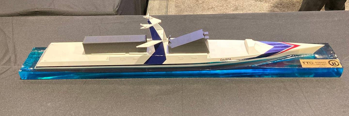A model of <em>Defiant</em> shown by Serco Inc. on the floor of the Navy League's Sea Air Space 2024. <em>Joseph Trevithick</em>