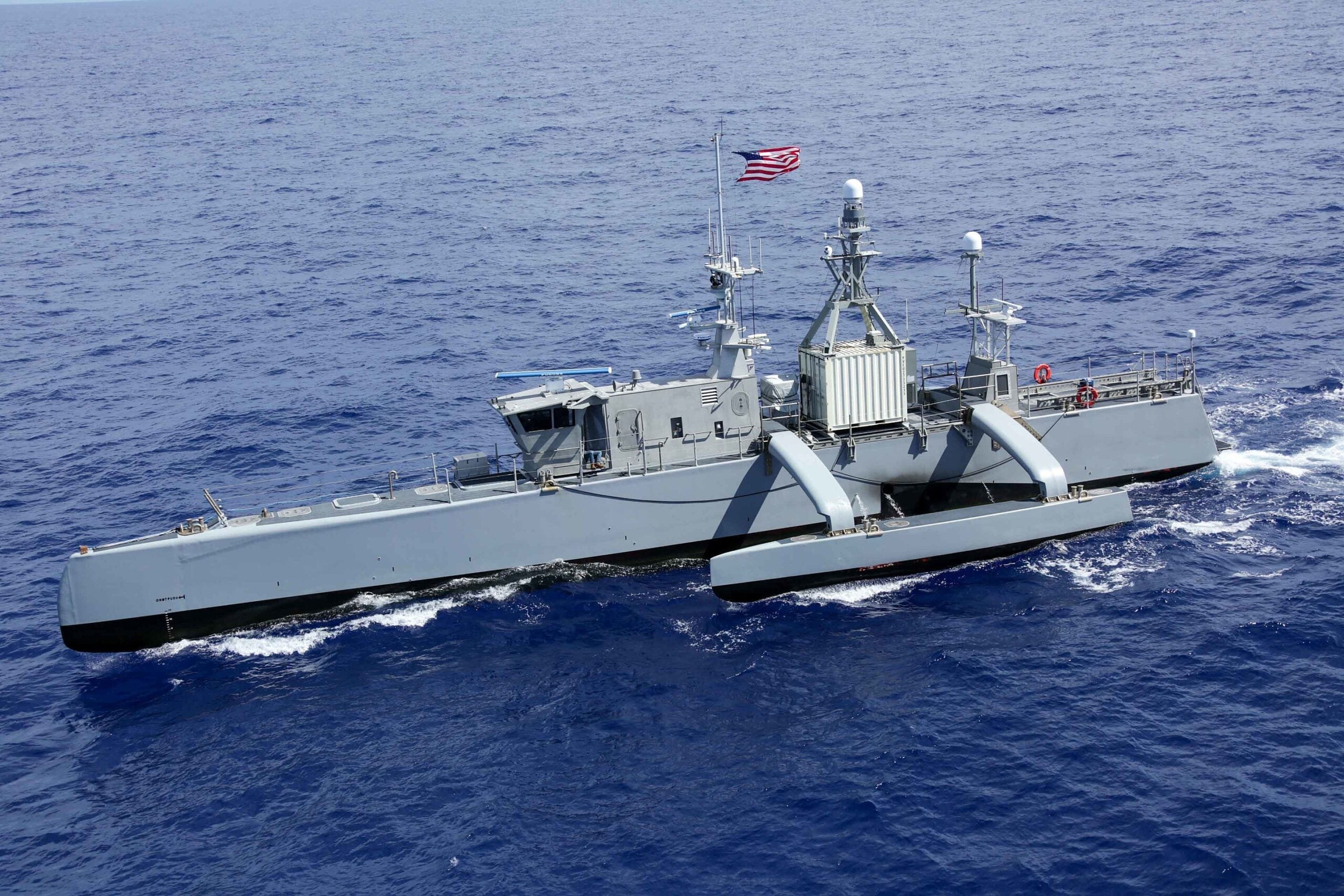 220728-N-DF558-1750 PACIFIC OCEAN (July 28, 2022) Medium displacement unmanned surface vessel Sea Hunter sails in formation during Rim of the Pacific (RIMPAC) 2022, July 28. Twenty-six nations, 38 ships, three submarines, more than 30 unmanned systems, approximately 170 aircraft and 25,000 personnel are participating in RIMPAC from June 29 to Aug. 4 in and around the Hawaiian Islands and Southern California. The world’s largest international maritime exercise, RIMPAC provides a unique training opportunity while fostering and sustaining cooperative relationships among participants critical to ensuring the safety of sea lanes and security on the world’s oceans. RIMPAC 2022 is the 28th exercise in the series that began in 1971. (U.S. Navy photo by Mass Communication Specialist 3rd Class Aleksandr Freutel)