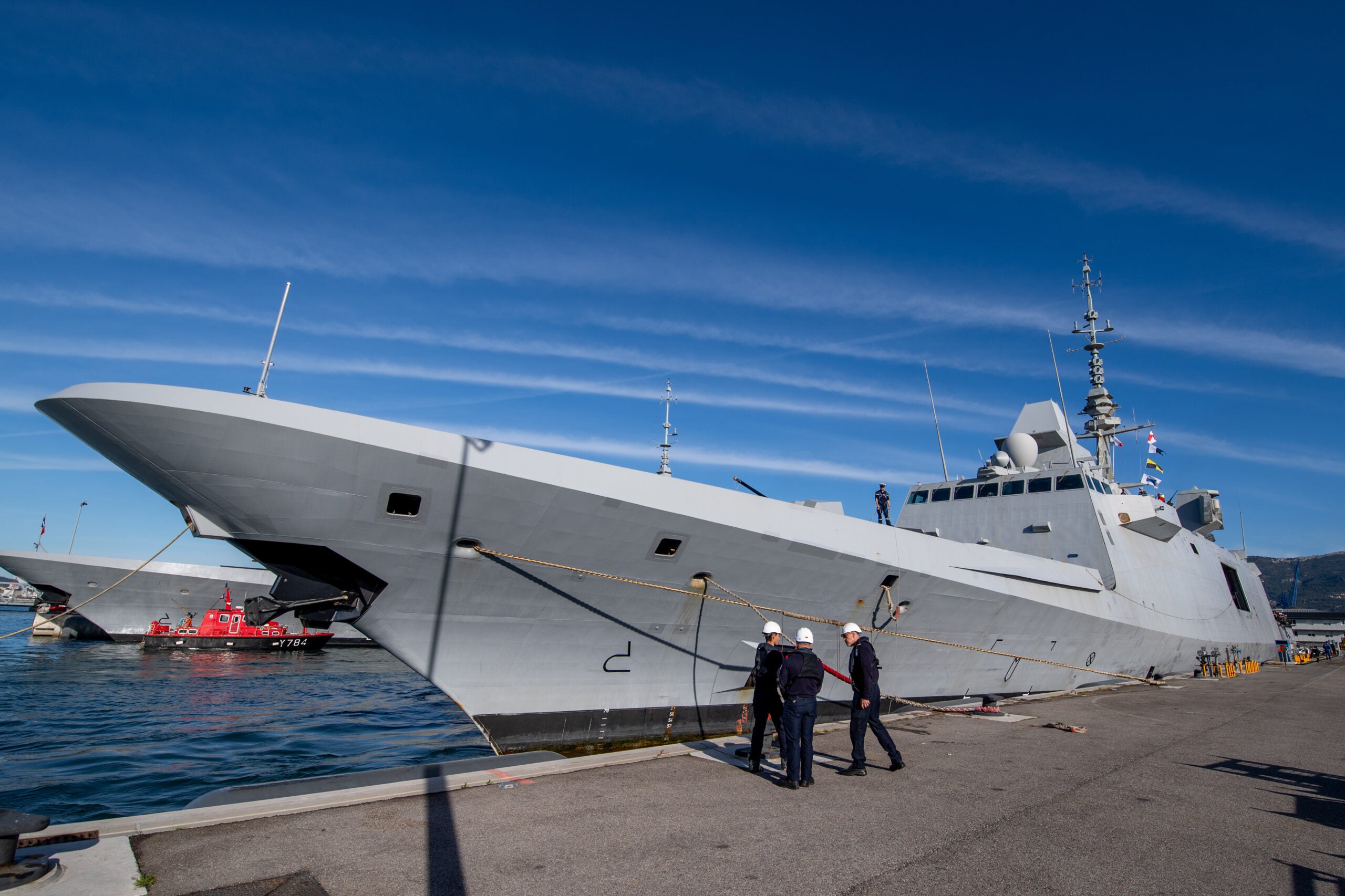TOULON, FRANCE - 2024/04/04: Sailors take part in the docking of the FREMM-DA (frégate multi-missions à capacité de défense aerienne renforcée) Alsace in Toulon. The French frigate Alsace returned to her home port of Toulon after a three-month mission in the Red Sea and Indian Ocean to defend merchant ships against attacks by Houti rebels. (Photo by Laurent Coust/SOPA Images/LightRocket via Getty Images)