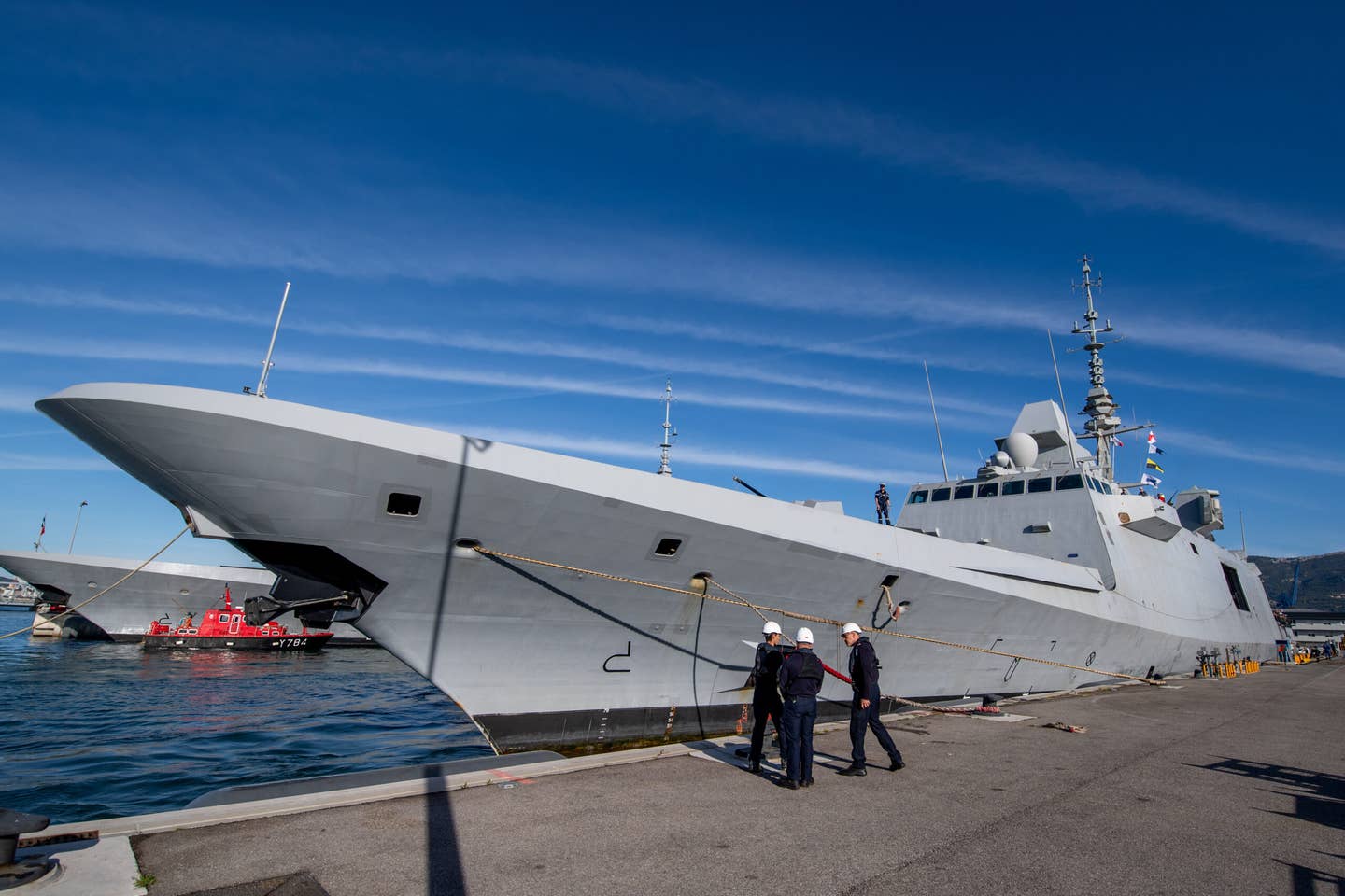 Sailors take part in the docking of the Alsace in Toulon on April 4, 2024. <em>Photo by Laurent Coust/SOPA Images/LightRocket via Getty Images</em>