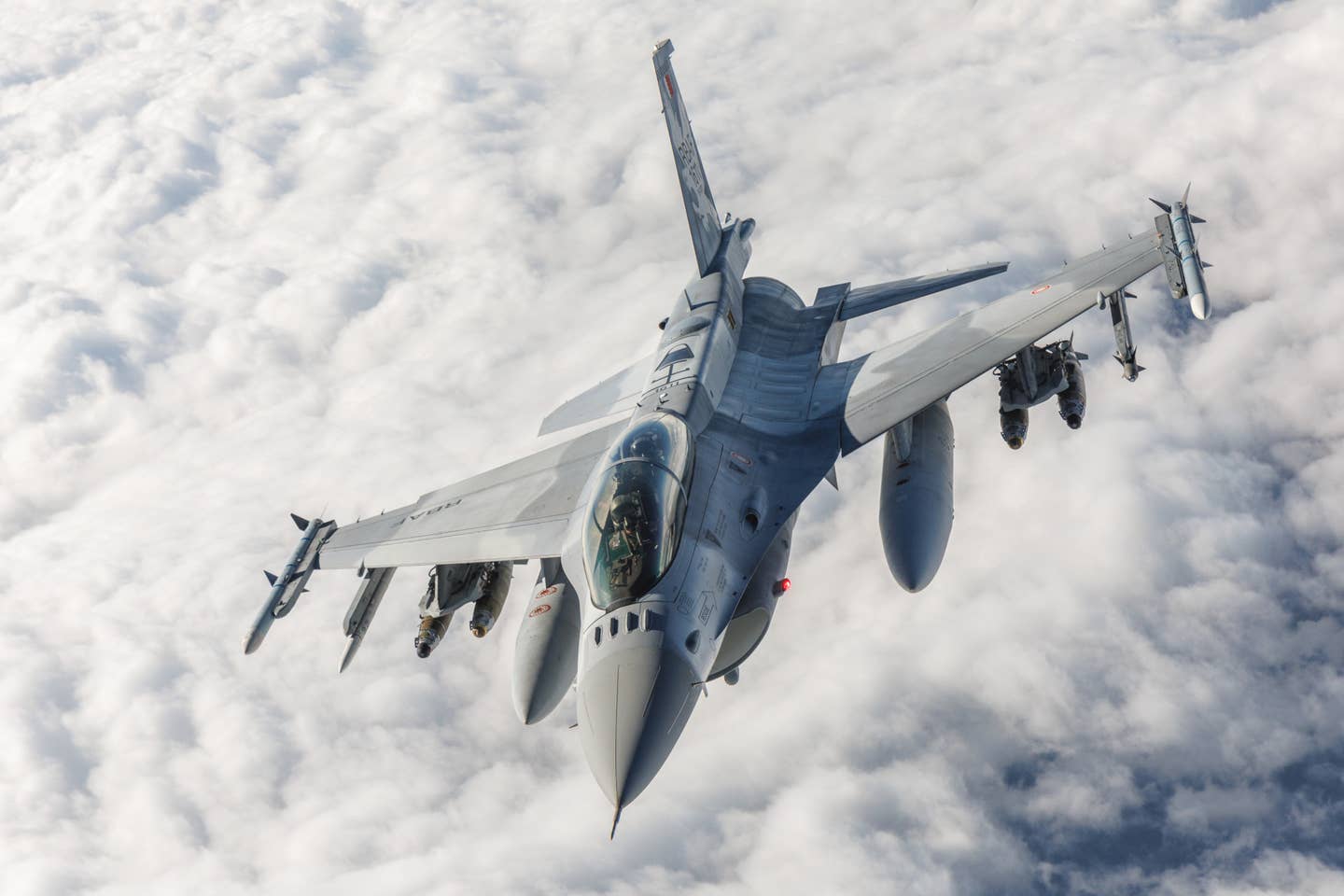 A Bahraini Block 70 F-16D flown by members of the 416th Flight Test Squadron pulls away after receiving fuel from a KC-135 tanker with a crew from the 370th Flight Test Squadron during a<em> </em>sortie out of Edwards Air Force Base in California on March 7, 2024. <em>USAF</em>