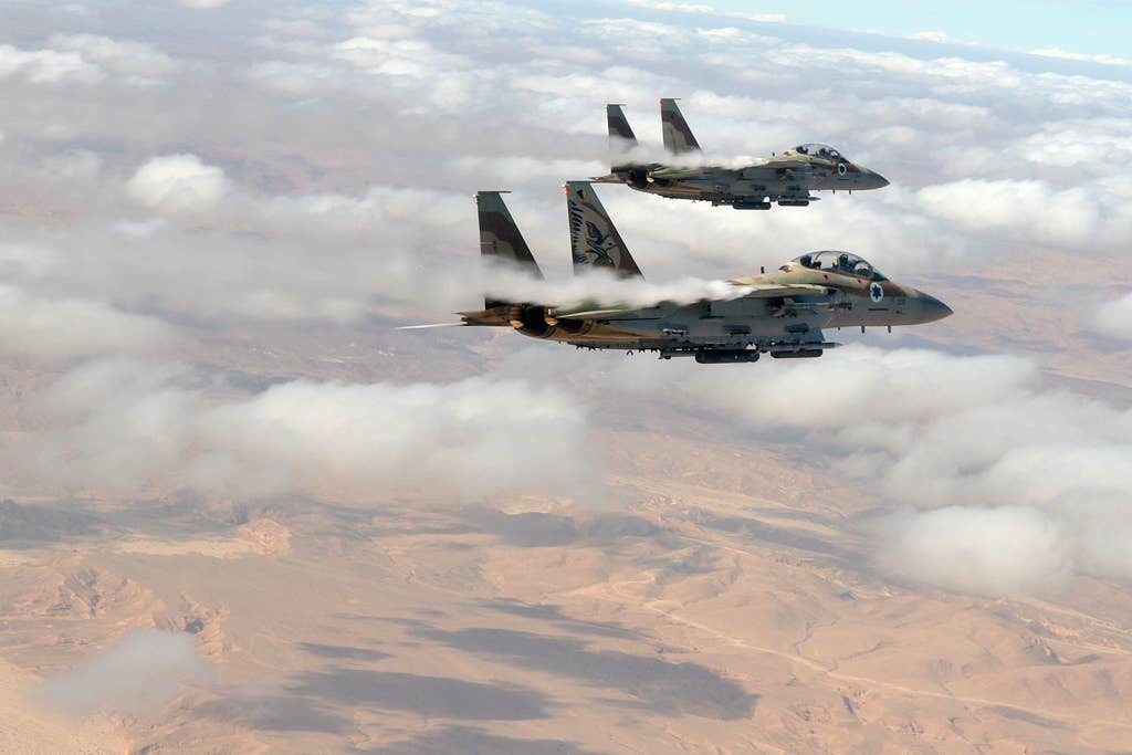 Two Israeli Air Force F-15I Ra’am strike fighters flying above the Negev desert.<em> Israeli Air Force</em>