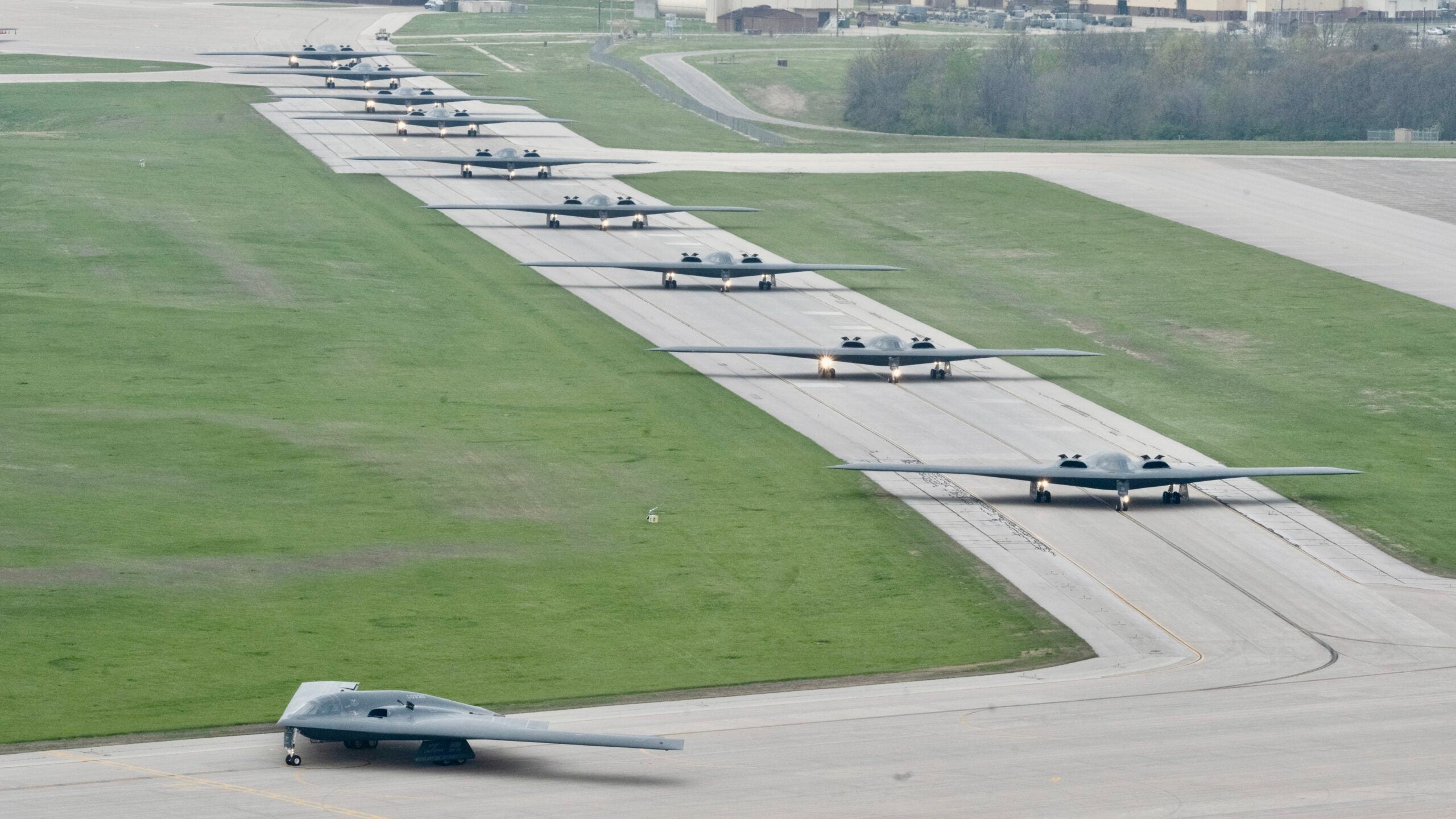 B-2 Spirit stealth bombers assigned to the 509th Bomb Wing taxi on the runway at Whiteman Air Force Base, Mo., April 15, 2024. Team Whiteman executed a mass fly-off of 12 B-2s to cap off the annual Spirit Vigilance exercise. Routine training ensures that Airmen are always ready to execute global strike operations… anytime, anywhere. (U.S. Air Force photo by Airman 1st Class Hailey Farrell)