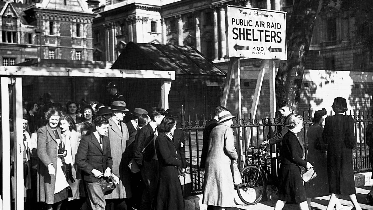 Londoners emerge safely from underground bomb shelters after an air raid. (Photo by © CORBIS/Corbis via Getty Images)