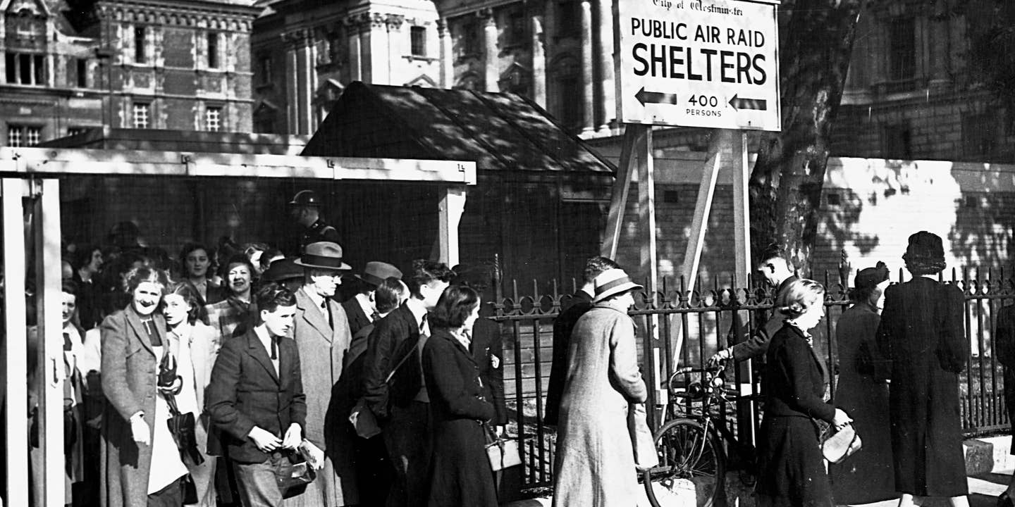 Londoners emerge safely from underground bomb shelters after an air raid. (Photo by © CORBIS/Corbis via Getty Images)
