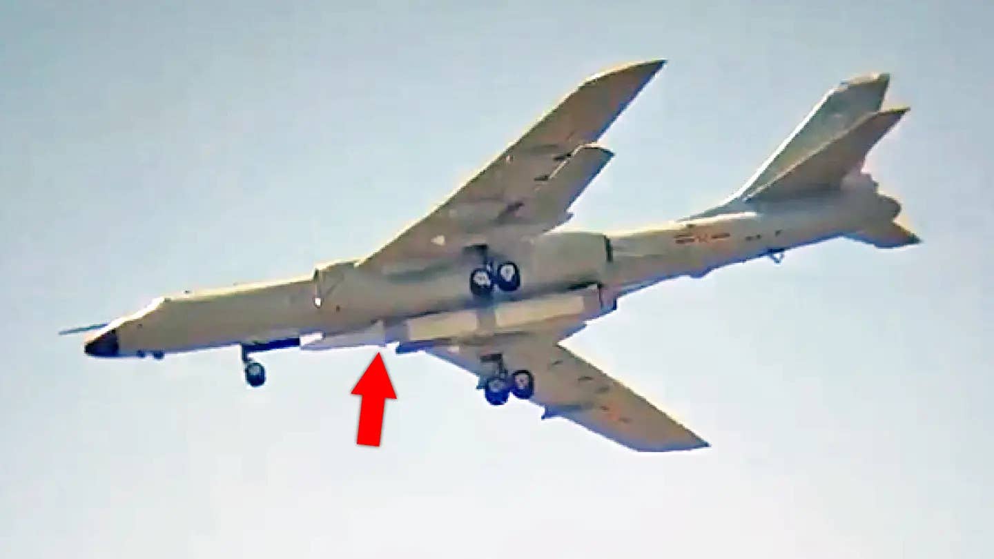 An H-6N carrying what looks to be an air-launched ballistic missile (indicated by the red arrow). This is one of several missiles the type has been observed loaded with on its centerline station. <em>Chinese Internet</em>