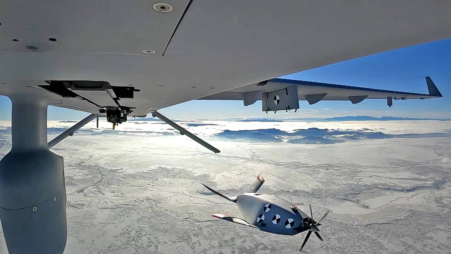 An MQ-1C releases a smaller Eaglet drone in a test. <em>GA-ASI</em>