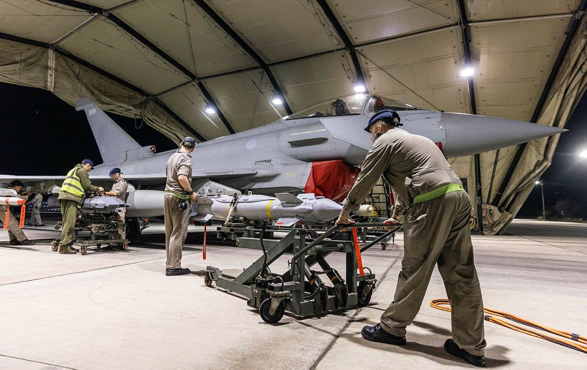 A U.K. Royal Air Force Typhoon FGR4 has Paveway IV weapons loaded by weapon technicians ahead of strikes against Houthi targets on February 22, 2024. <em>Crown Copyright&nbsp;</em>