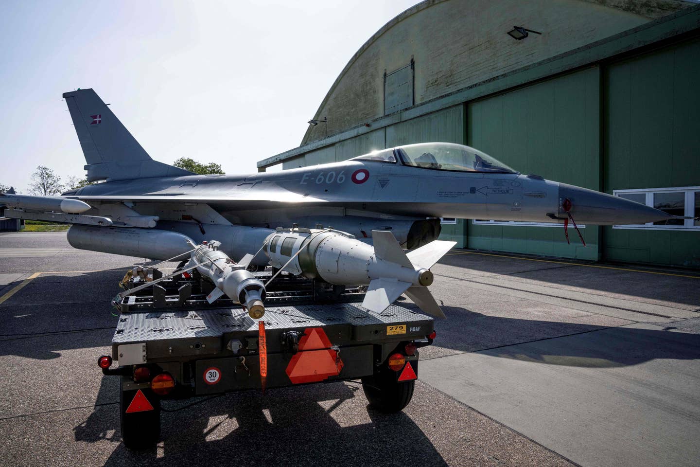 A Paveway series bomb and a JDAM in front of a Danish F-16 at Skrydstrup Air Base in Denmark on May 25, 2023. <em>Photo by BO AMSTRUP/Ritzau Scanpix/AFP via Getty Images</em>
