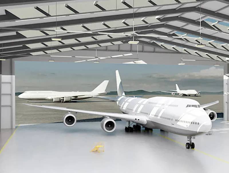 A rendering of 747-8s inside and outside of SNC's new hangar in Dayton, Ohio. <em>SNC</em>