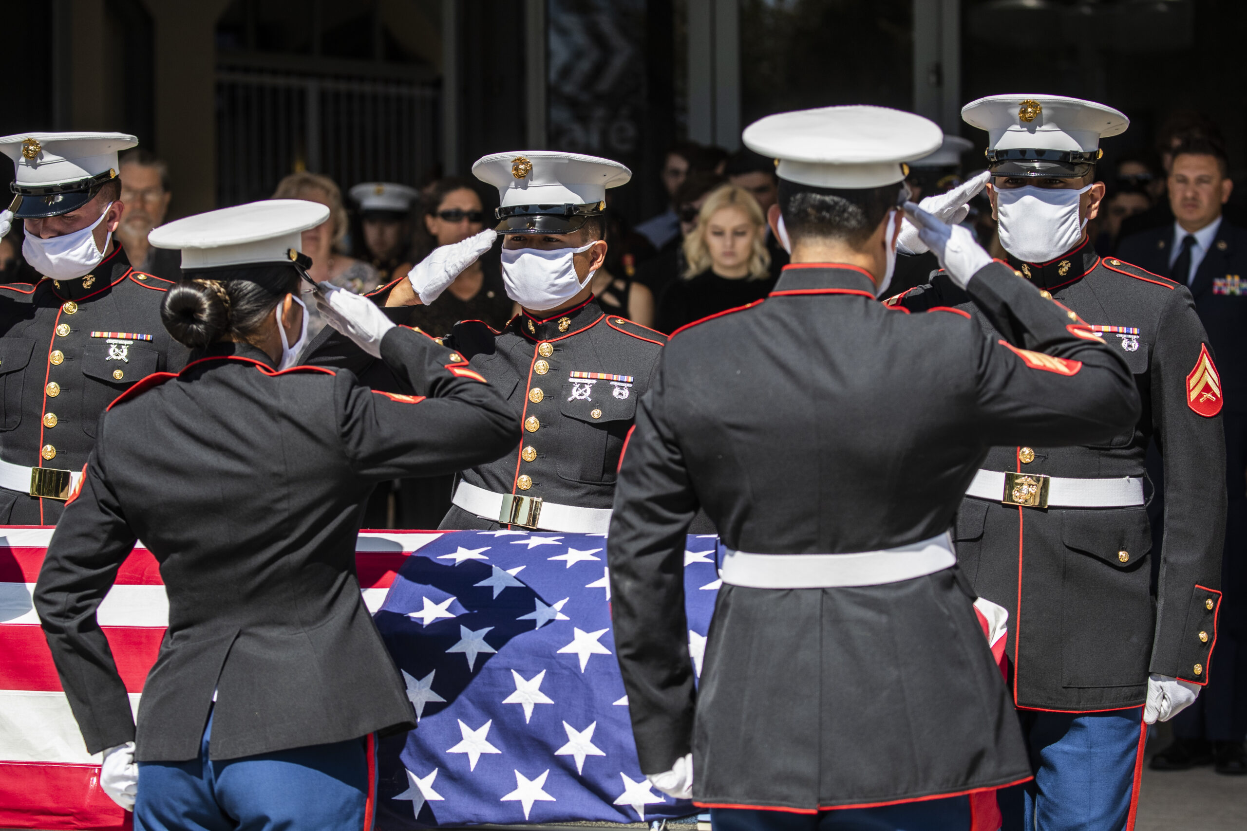 U.S. Marines pallbearers salute the casket of Sgt. Nicole L. Gee during a public memorial service at Bayside Church Adventure Campus in Roseville, Calif. Saturday, Sept. 18, 2021. Gee, 23, assigned to Combat Logistics Battalion, 24th Marine Expeditionary Unit, II Marine Expeditionary Force, Camp Lejeune, North Carolina, died in a bombing attack at Hamid Karzai International Airport in Kabul, Afghanistan on August 26, along with 12 other U.S. service members. (Stephen Lam/The San Francisco Chronicle via Getty Images)