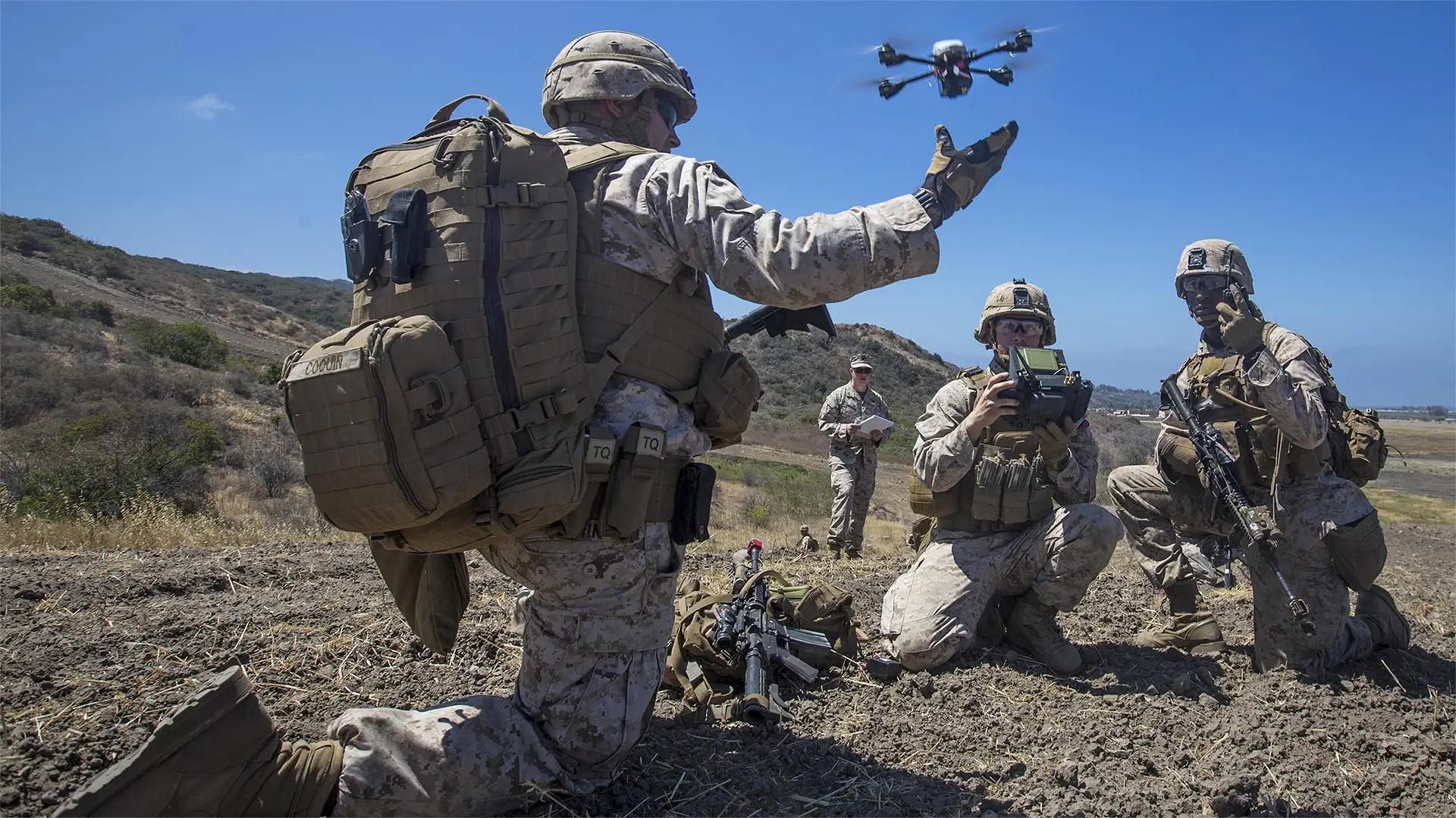 A Marine launches a small quadcopter-type drone during training.<em> USMC</em>