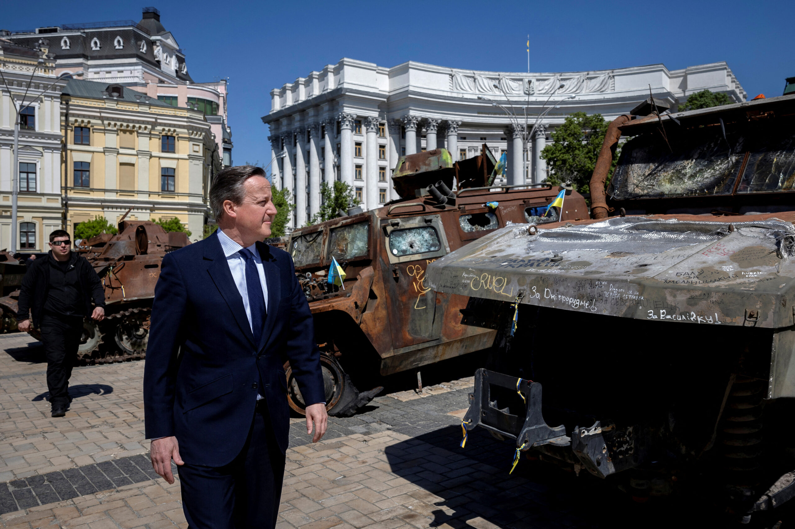 British Foreign Secretary David Cameron walks past a display of destroyed Russian military vehicles in Kyiv on May 2, 2024. <em>Photo by Thomas Peter-Pool/Getty Images</em>