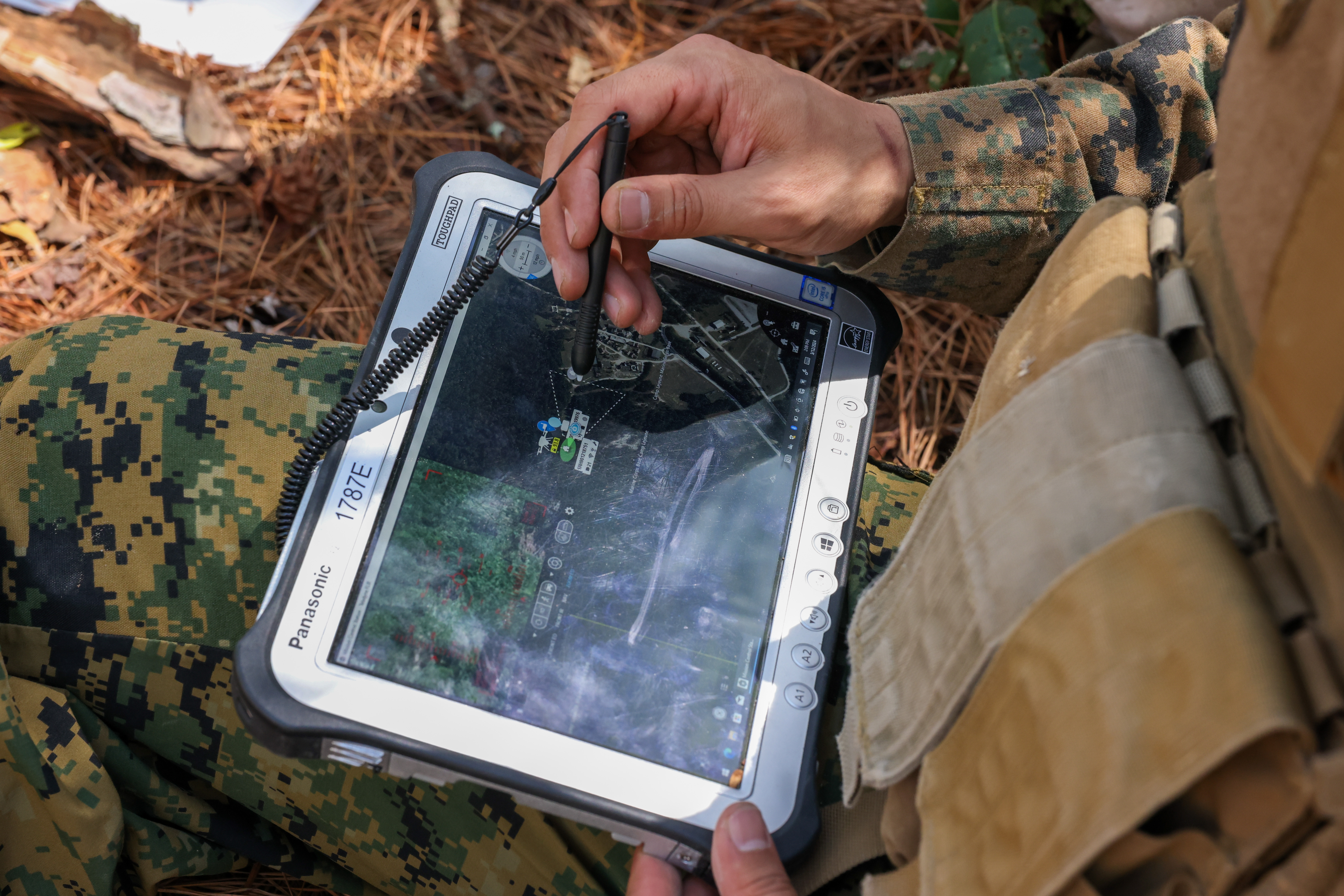 U.S. Marine Corps Staff Sgt. Jacob Sprankle, a student with Small Unmanned Aerial System School and a native of Little Rock, Arkansas, uses a tablet to control a R80D Skyraider during an exercise at Marine Corps Base Camp Lejeune, North Carolina, Mar. 12, 2024. Marines with SUASS practiced tactical flights and operations to simulate scenarios such as moving cargo, navigation, and concealment. (U.S. Marine Corps photo by Lance Cpl. Zachary Candiani)