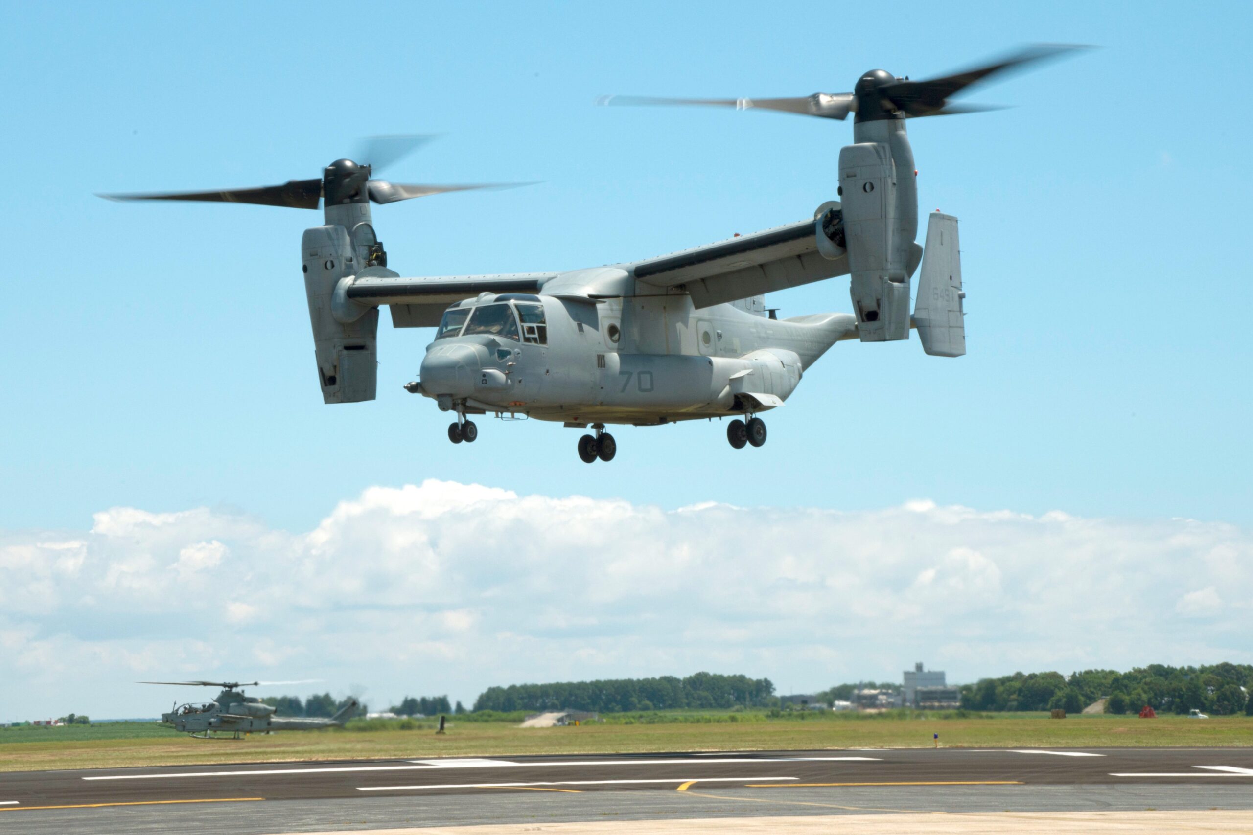 An MV-22B Osprey equipped with a 3D printed titanium link and fitting inside an engine nacelle maintains a hover as part of a demonstration at Patuxent River Naval Air Station, Maryland, July 29, 2016. <em>NAVAIR</em>