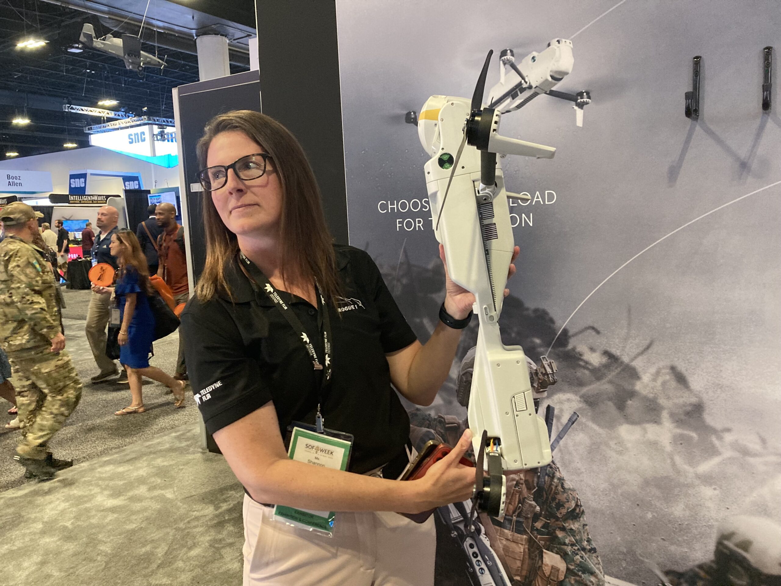 Teledyne FLIR Defense senior marketing manager Shannon Jidas holds up a Rogue 1 drone at the SOF Week special operations conference in Tampa. (Howard Altman/staff )