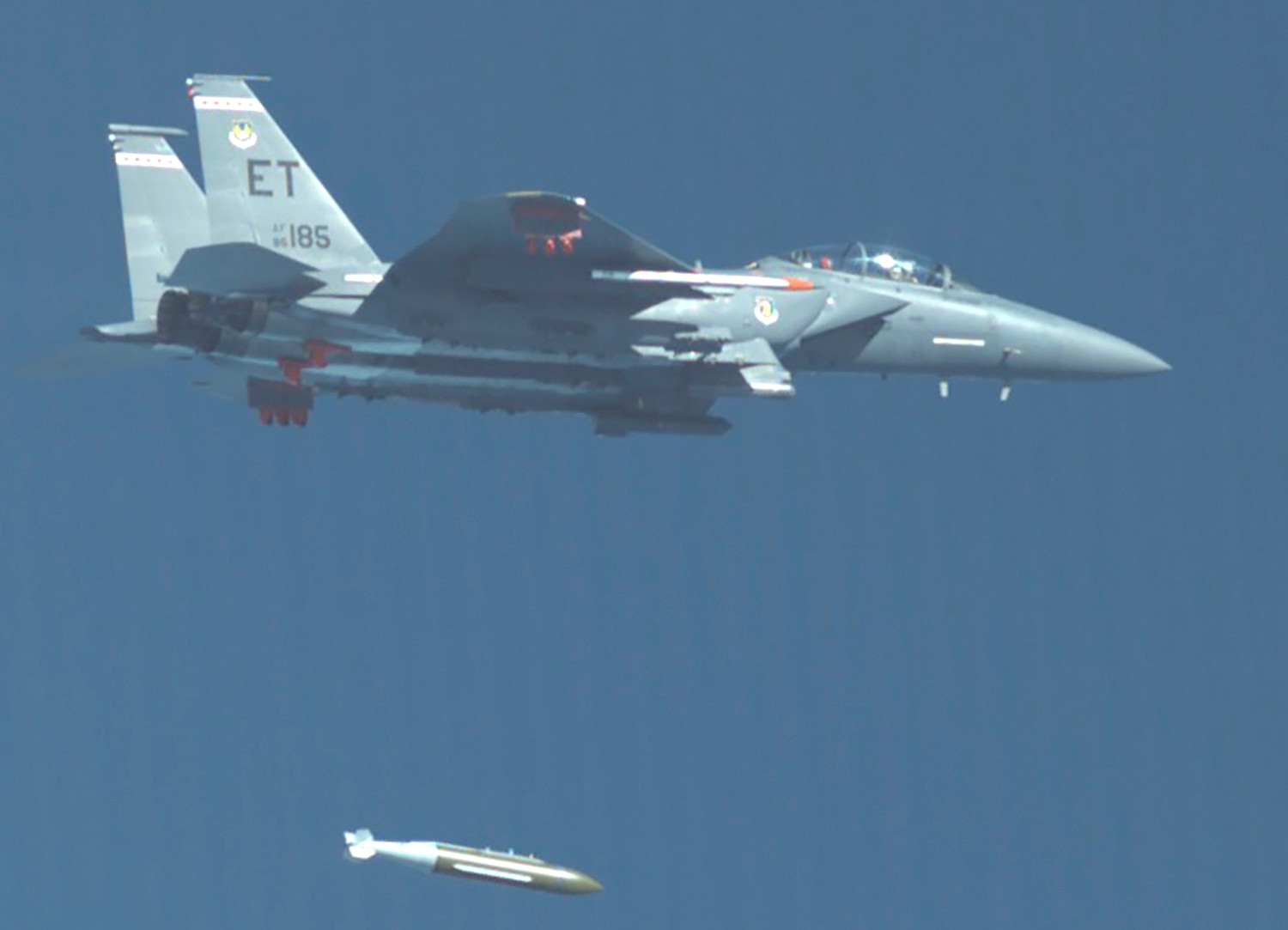 An F-15E Strike Eagle drops a GBU-72/B during a test. <em>USAF</em>