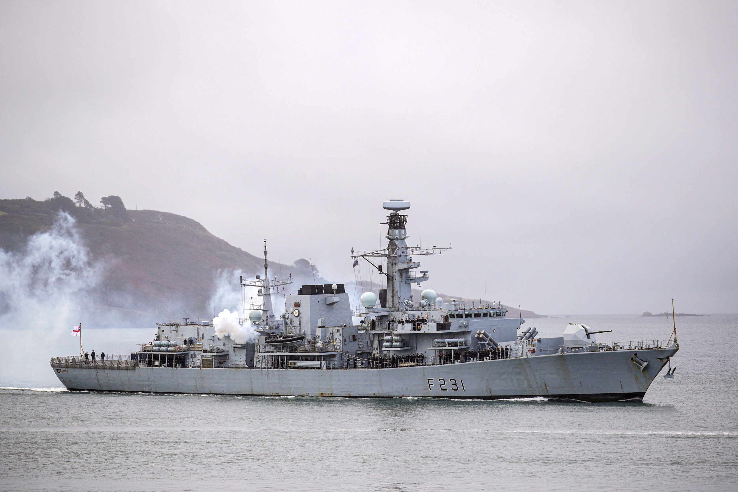 Pictured is the Royal Navy frigate HMS Argyll, firing a salute as she returns home to Devonport after nearly six months on constant operations in the punishing Gulf heat deployed on Operation Kipion. 

Nearly six million tonnes of shipping  68 merchant vessels carrying goods, oil and natural gas  has been safely monitored through key sea lanes in the Middle East since the Plymouth-based ship arrived in the region in April 2020.

HMS Argyll is the longest serving Type 23 Frigate in the Royal Navy, but an extensive refit and capability upgrade saw her emerge in 2017 as one of the most technologically capable Frigates in the Royal Navy.

HMS Argylls Motto is  Ne Obliviscarus (Lest we forget)