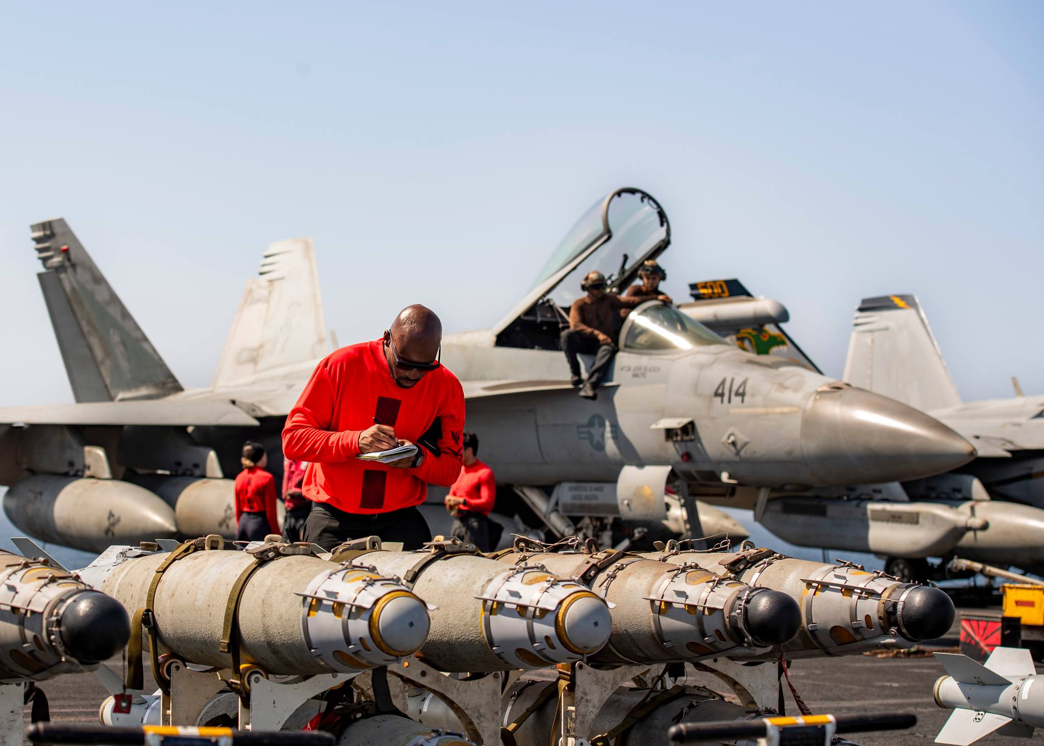 240224-N-DH109-1062 RED SEA (Feb. 24, 2024) Aviation Ordnanceman quality checks ordnance in preparation of flight operations aboard the Nimitz-class aircraft carrier USS Dwight D. Eisenhower (CVN 69) in the Red Sea, Feb. 24. The Dwight D. Eisenhower Carrier Strike Group is deployed to the U.S. 5th Fleet area of operations to support maritime security and stability in the Middle East region. (U.S. Navy photo)