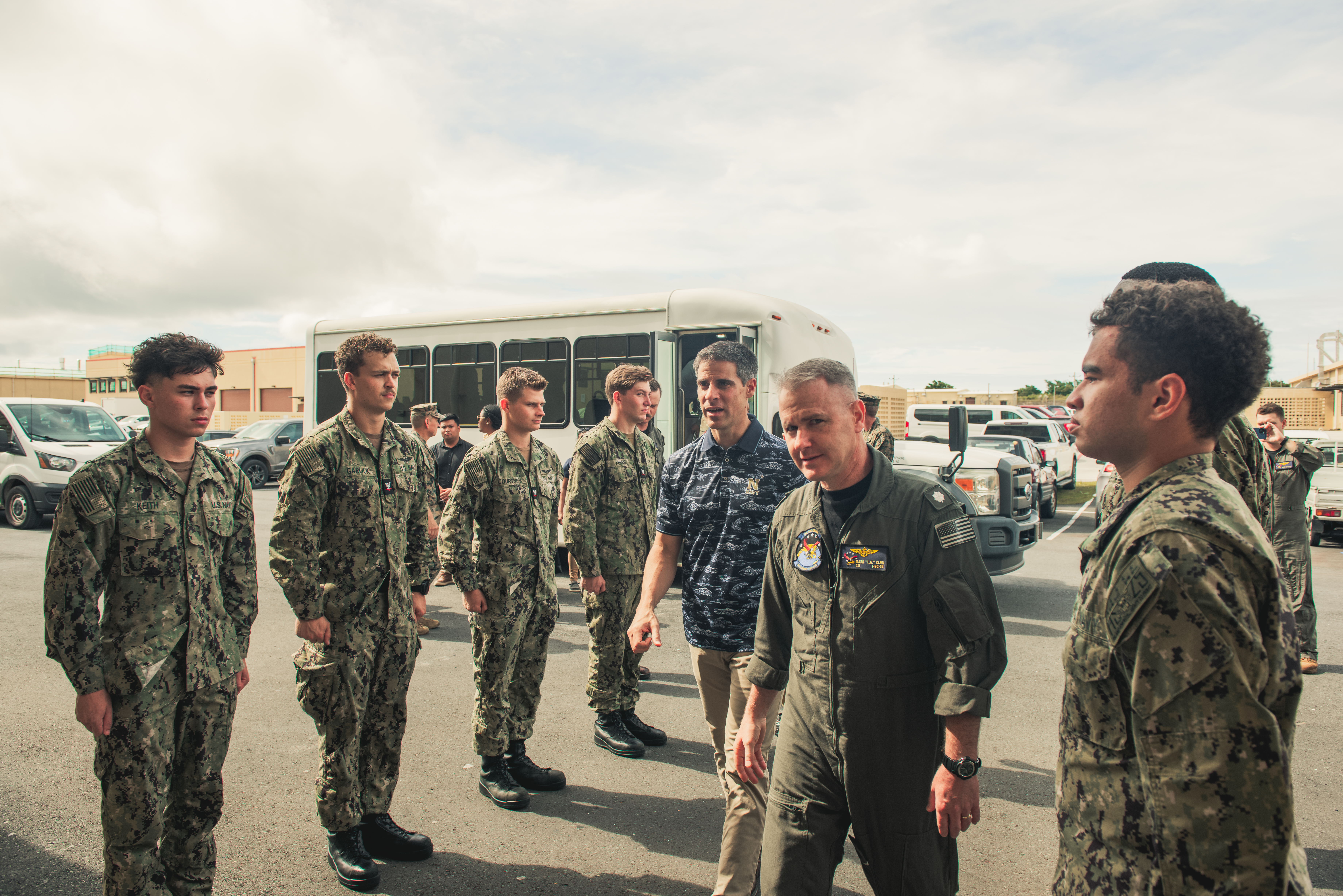 ANDERSEN AIR FORCE BASE, GUAM (Oct. 17, 2024) – Acting Under Secretary of the Navy Tom Mancinelli is greeted by Navy Cmdr. Mark Klein, commanding officer of the "Island Knights" of Helicopter Sea Combat Squadron (HSC) 25, during a tourm, Oct. 17. The visit highlighted the squadron’s role in supporting regional operations and its contributions to maintaining readiness in the Indo-Pacific region. (U.S. Navy photo by William J. Busby III)