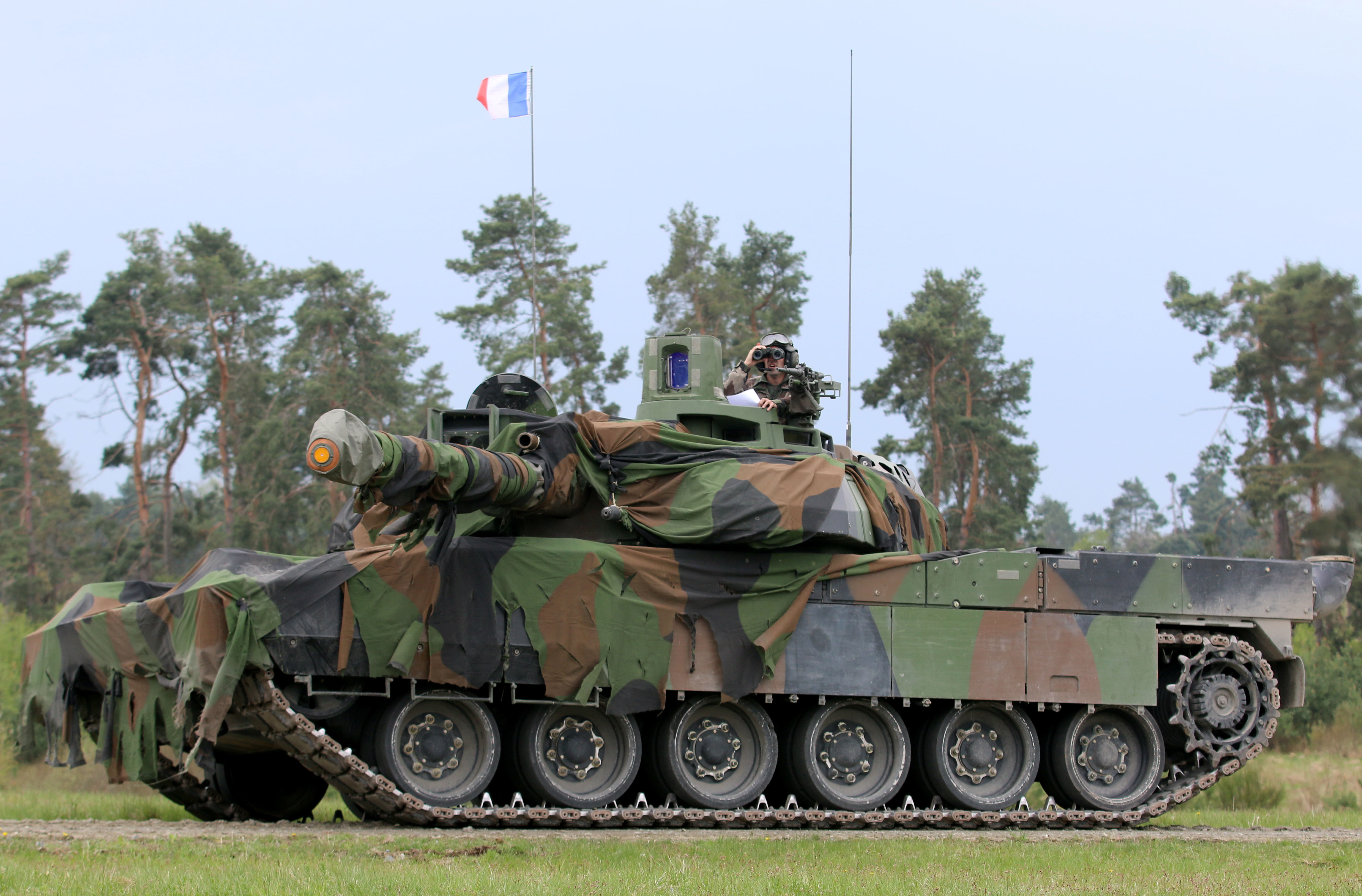 A French soldier on the France Leclere tank identifies friendly and enemy vehicles while navigating a short course here, May 8. The Strong Europe Tank Challenge is co-hosted by U.S. Army Europe and the German Army, May 7-12, 2017. The competition is designed to project a dynamic presence, foster military partnership, promote interoperability, and provides an environment for sharing tactics, techniques and procedures. Platoons from six NATO and partner nations are in the competition. (U.S. Army photo by Staff Sgt. Kathleen V. Polanco)