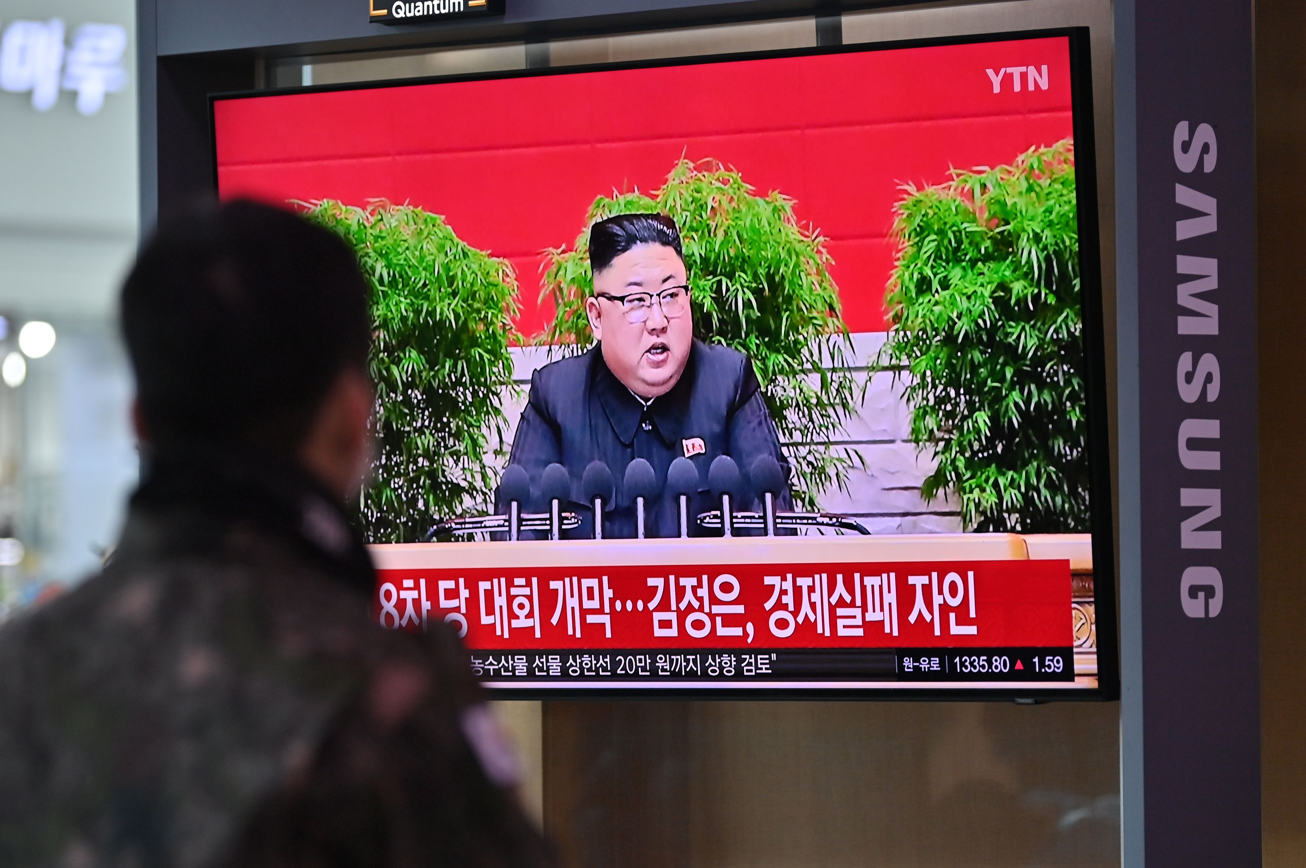 A man watches a television screen showing news footage of North Korean leader Kim Jong Un attending the 8th congress of the ruling Workers' Party held in Pyongyang, at a railway station in Seoul on January 6, 2021. (Photo by Jung Yeon-je / AFP) (Photo by JUNG YEON-JE/AFP via Getty Images)