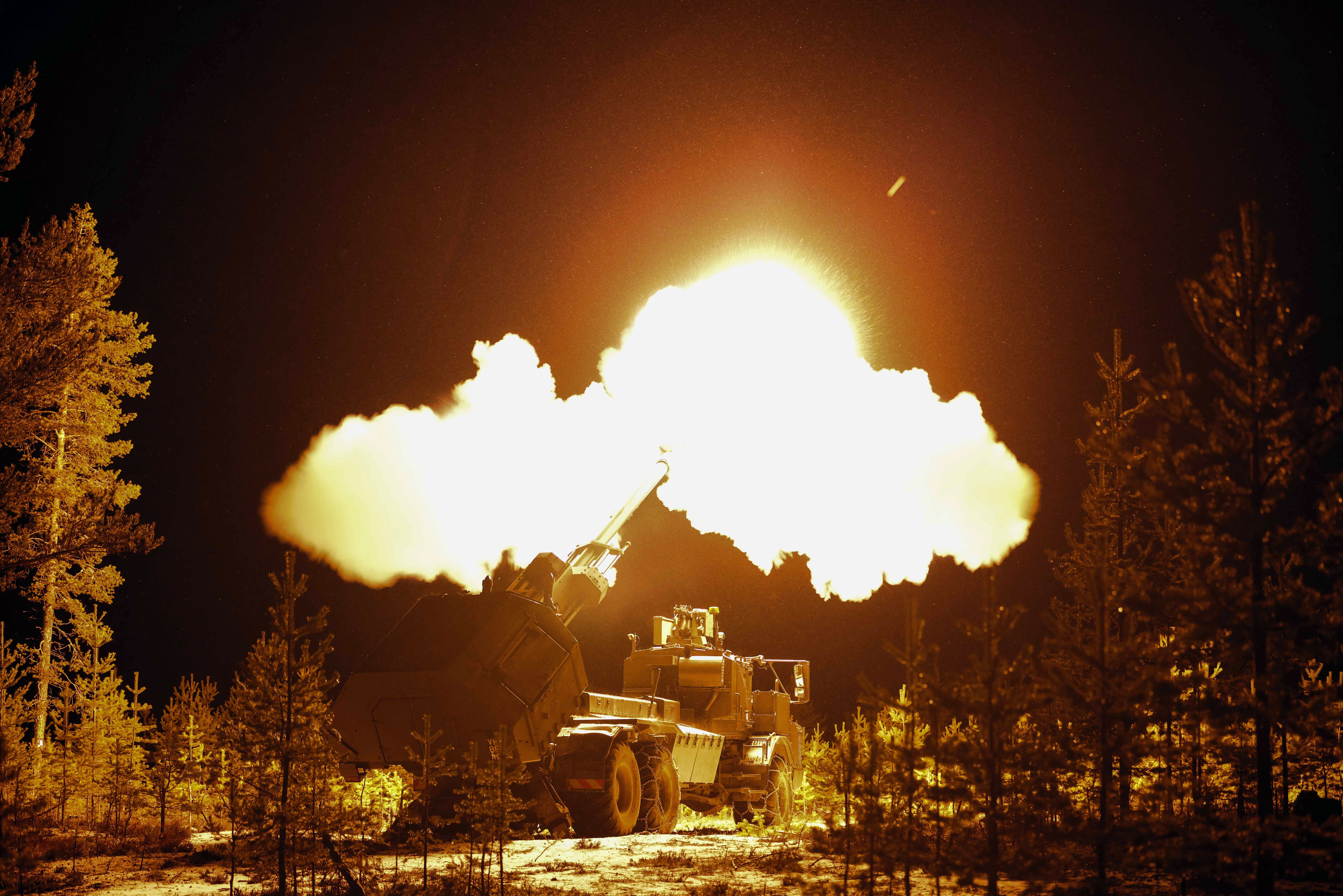 Pictured: An Archer Artillery Gun is fired at night by troops from 19th Regiment Royal Artillery, during a live range on Rovajärvi Training Area during Exercise Dynamic Front, Finland. More than 250 British Army soldiers are taking part in Exercise Dynamic Front in Rovaniemi, Finland. Troops from 19th Regiment Royal Artillery will be firing the new Archer artillery 155mm gun for the first time on exercise in a tactical environment, with 5th Regiment Royal Artillery also operating the new Taipan radar system for the first time on exercise. Exercise Dynamic Front involves more than 5,000 multinational NATO soldiers from 28 countries.