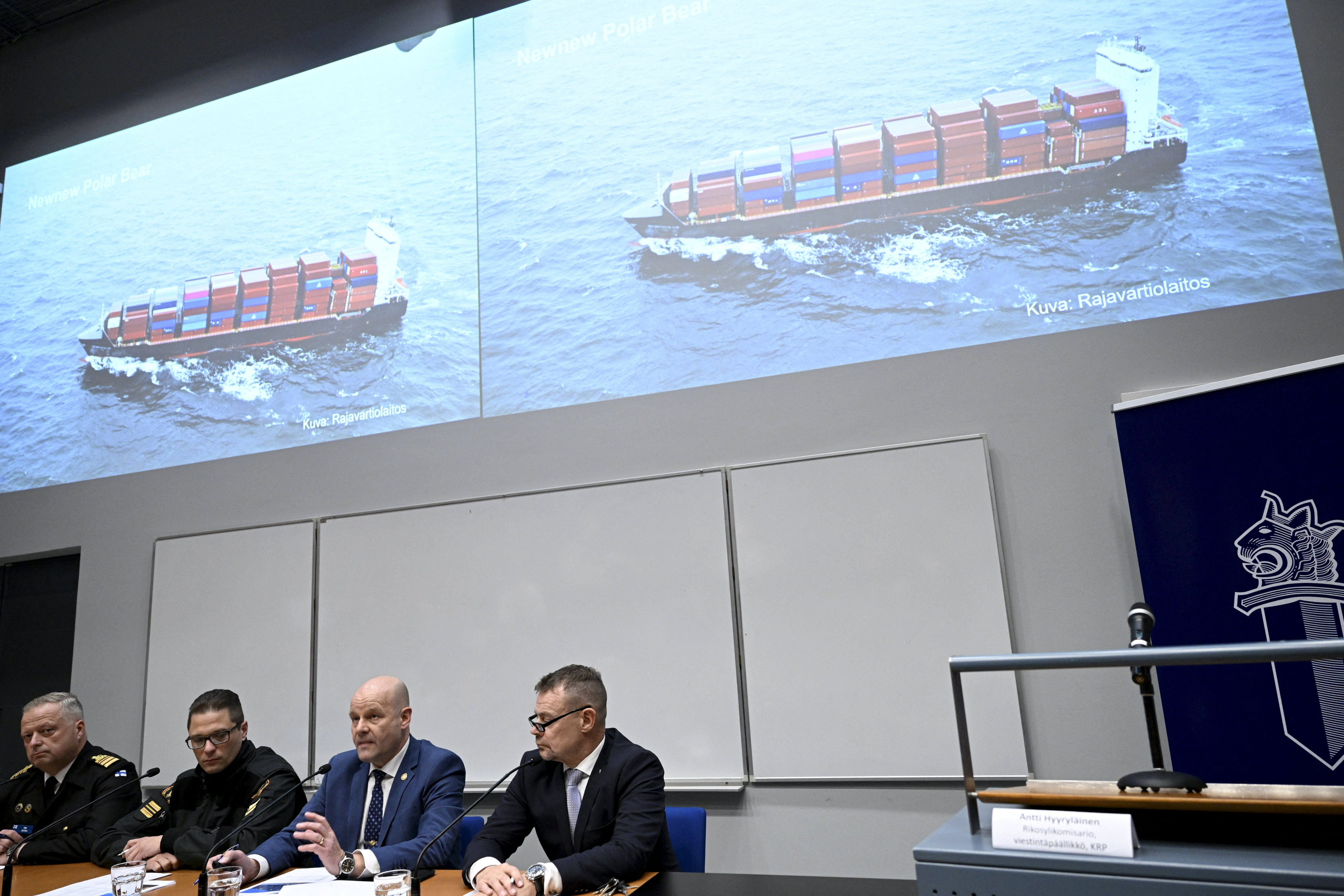 The commanding officer of the Finnish Navy Toni Joutsia (L to R), lieutenant commander of the Finnish Border Guard Markus Paljakka, the detective inspector of the National Bureau of Investigation Risto Lohi and the Chief of National Bureau of Investigation Robin Lardot attend a joint press conference of the investigation of the possible attack on the Balticconnector gas line on October 8, 2023 between Finland and Estonia at the headquarters of the National Bureau of Investigation in Vantaa, Finland on October 24, 2023. The screen shows Finnish Border Guard's photo of a Hong Kong -registered cargo ship 'Newnew Polar Bear', which was spotted moving close to the Balticconnector gas line.Finnish police said a Chinese ship was the focus of their investigation into suspected sabotage of the Balticconnector pipeline. (Photo by Heikki Saukkomaa / Lehtikuva / AFP) / Finland OUT (Photo by HEIKKI SAUKKOMAA/Lehtikuva/AFP via Getty Images)