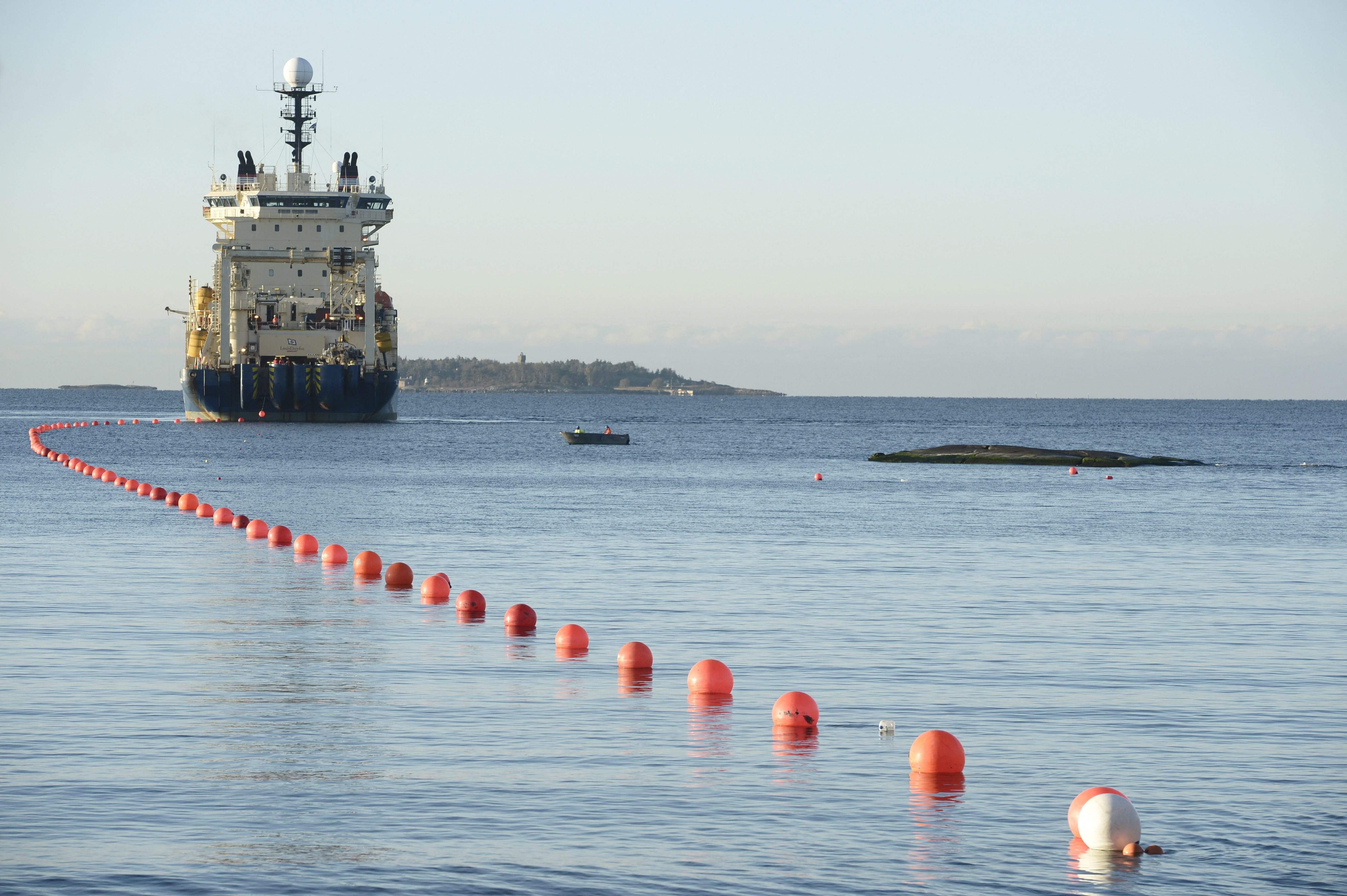 This picture taken on October 12, 2015 shows the C-Lion1 submarine telecommunications cable being laid to the bottom of the Baltic Sea by cable laying ship "Ile de Brehat" off the shore of Helsinki, Finland. Germany and Finland said November 18, 2024 they were "deeply concerned" that an undersea telecommunications cable linking the countries had been severed and opened a probe, at a time of high tensions with Russia. "Our European security is not only under threat from Russia's war of aggression against Ukraine, but also from hybrid warfare by malicious actors," the countries' foreign ministers said in a joint statement. sr/sea/js (Photo by Heikki Saukkomaa / Lehtikuva / AFP) / Finland OUT (Photo by HEIKKI SAUKKOMAA/Lehtikuva/AFP via Getty Images)