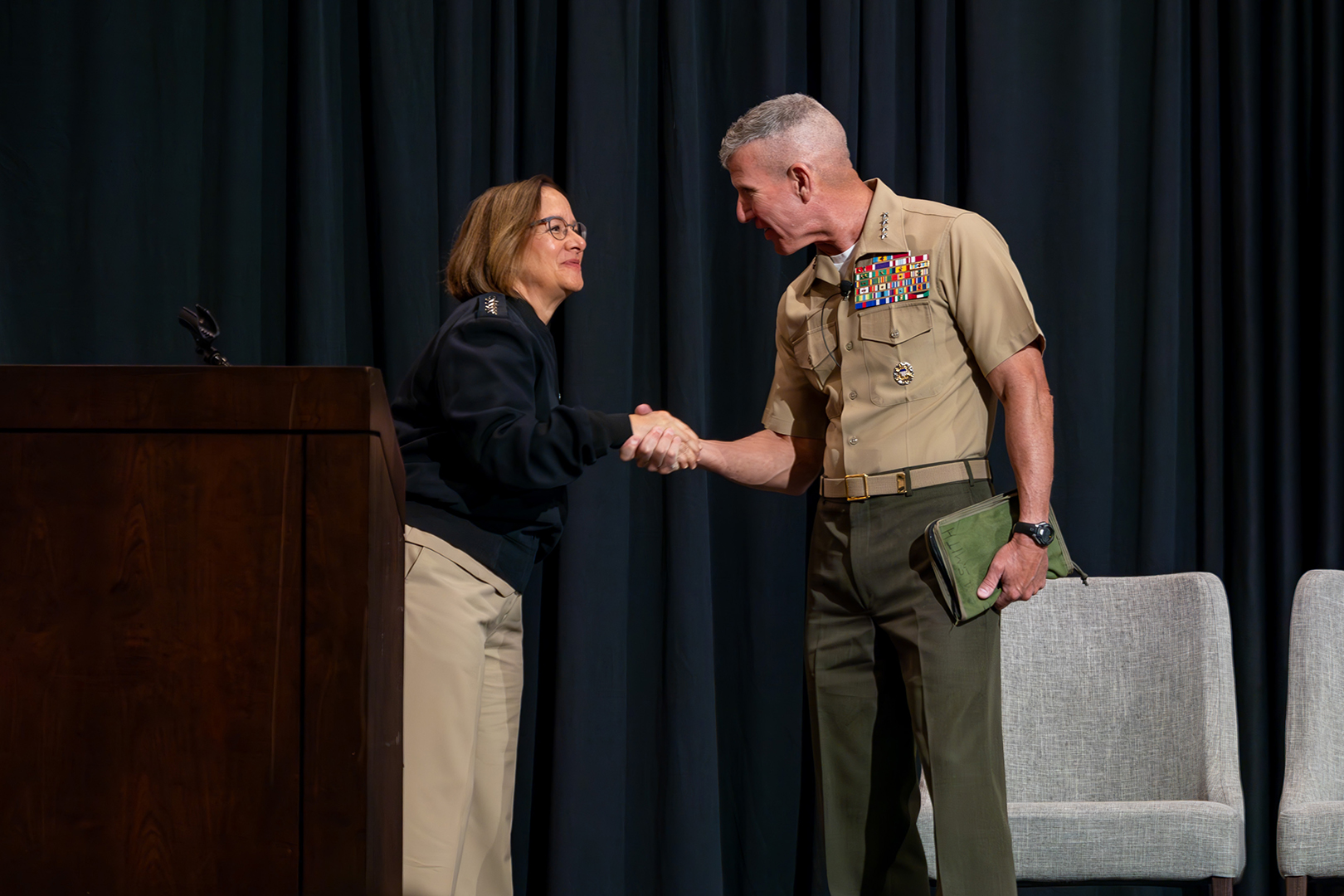 The 39th Commandant of the Marine Corps, Gen. Eric M. Smith, is greeted the 33rd Chief of Naval Operations, Adm. Lisa M. Franchetti, during the New Flag and Senior Executive Training Symposium (NFLEX) participants in Leesburg, VA on Oct. 21, 2024. NFLEX prepares new flag officers, senior executive service members, and command master chiefs for their new flag positions and enhances their executive management and leadership skills. (U.S. Marine Corps photo by Staff Sgt. Kelsey Dornfeld)