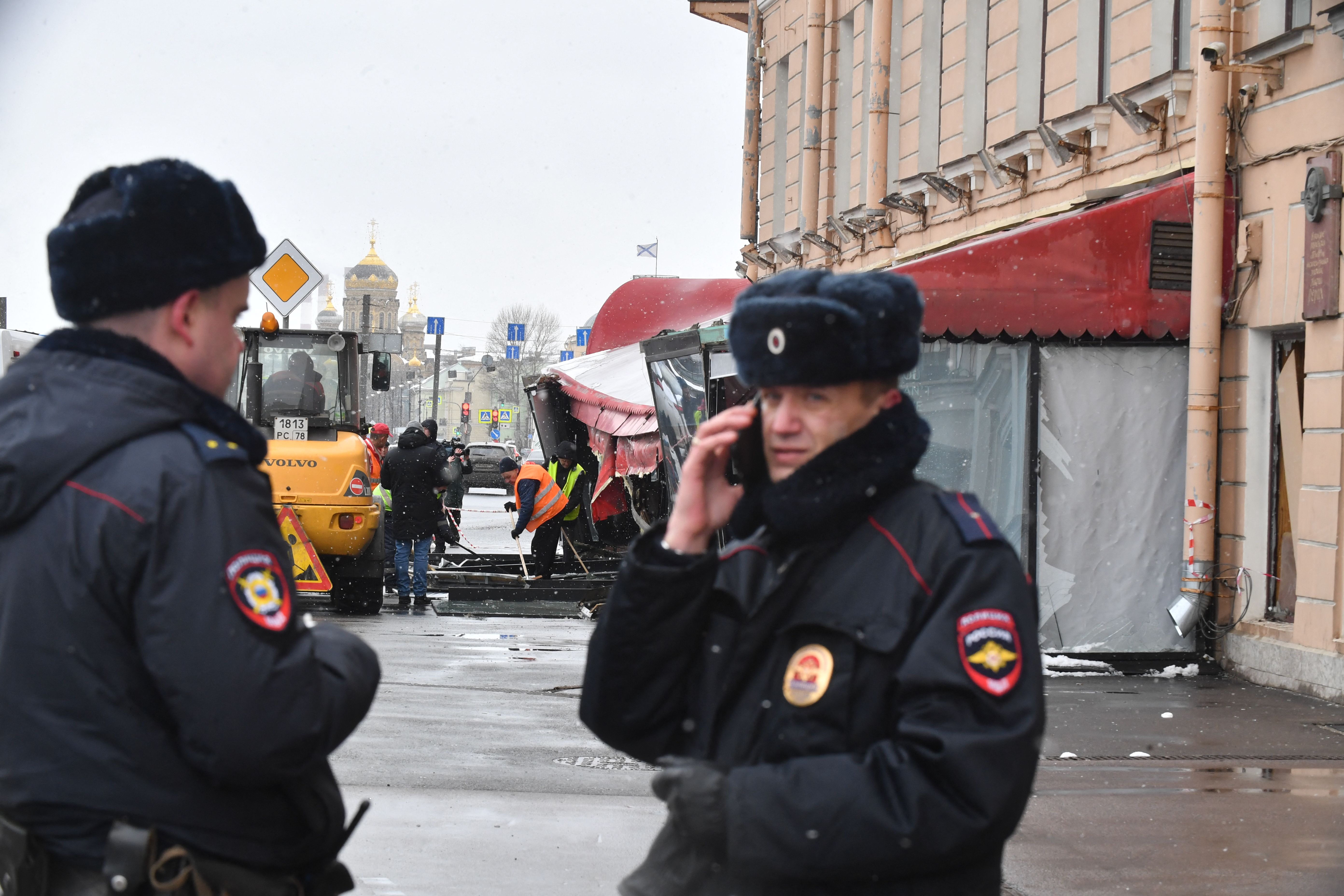 Municipal workers clean the debris in the aftermath of the April 2 bomb blast in a cafe in Saint Petersburg on April 3, 2023. - Sunday's explosion in a Saint Petersburg cafe wounded dozens and killed Russia's top military blogger Vladlen Tatarsky. (Photo by OLGA MALTSEVA / AFP) (Photo by OLGA MALTSEVA/AFP via Getty Images)
