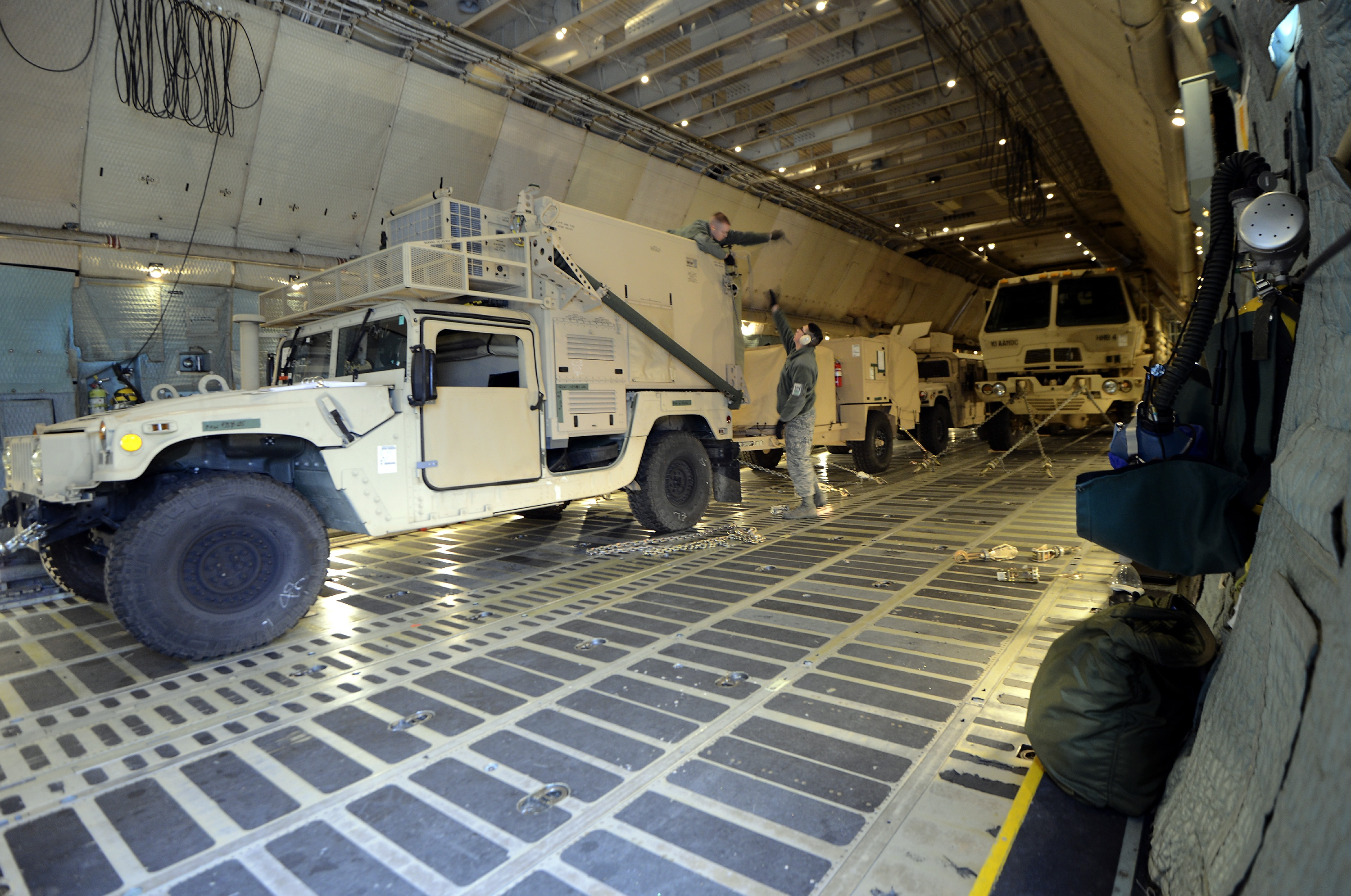 RAMSTEIN-MIESENBACH, GERMANY - JANUARY 08: Soldiers of the U.S. Army Europe's 10th Army Air and Missile Defense Command, who operate Patriot anti-missile systems, load cargo on board a plane C-5 Galaxy for Turkey at Ramstein Air Base on January 8, 2012 near Ramstein-Miesenbach, Germany. The troops are deploying along with Patriot batteries from Netherlands and Germany as part of a NATO operation called "Active Fence Turkey" meant to protect Turkey, which is also a NATO member state, from possible missile attack from Syria. (Photo by Thomas Lohnes/Getty Images)