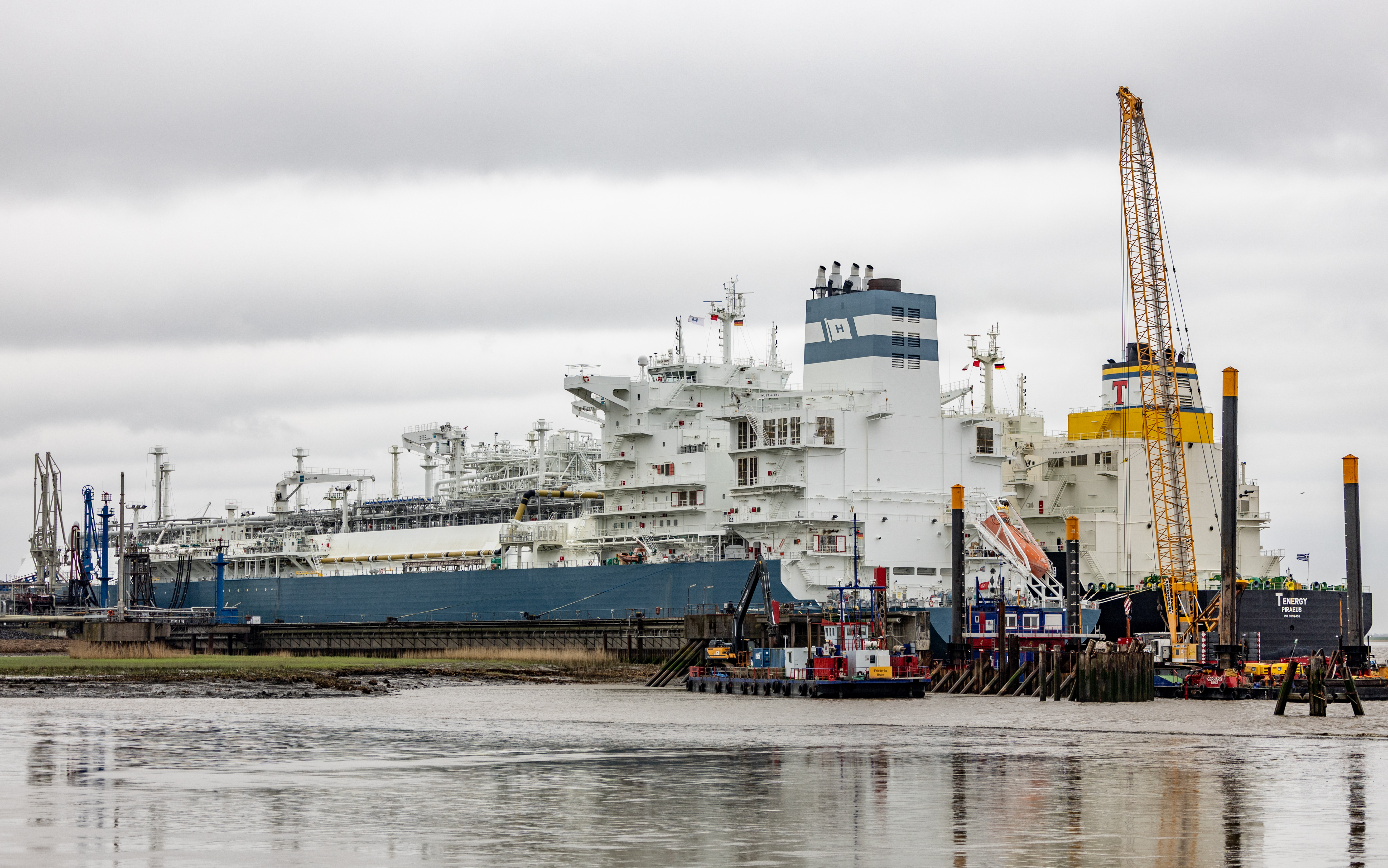 11 April 2024, Schleswig-Holstein, Brunsbüttel: In addition to the "Hoegh Gannef", a special ship for storing and feeding in liquefied natural gas, the "TEnergy", a carrier ship loaded with LNG, has docked in the Elbe port of Brunsbüttel. Today, the go-ahead was given for the structural work on the new jetty for the floating liquefied natural gas terminal "Jetty". Photo: Axel Heimken/dpa (Photo by Axel Heimken/picture alliance via Getty Images)