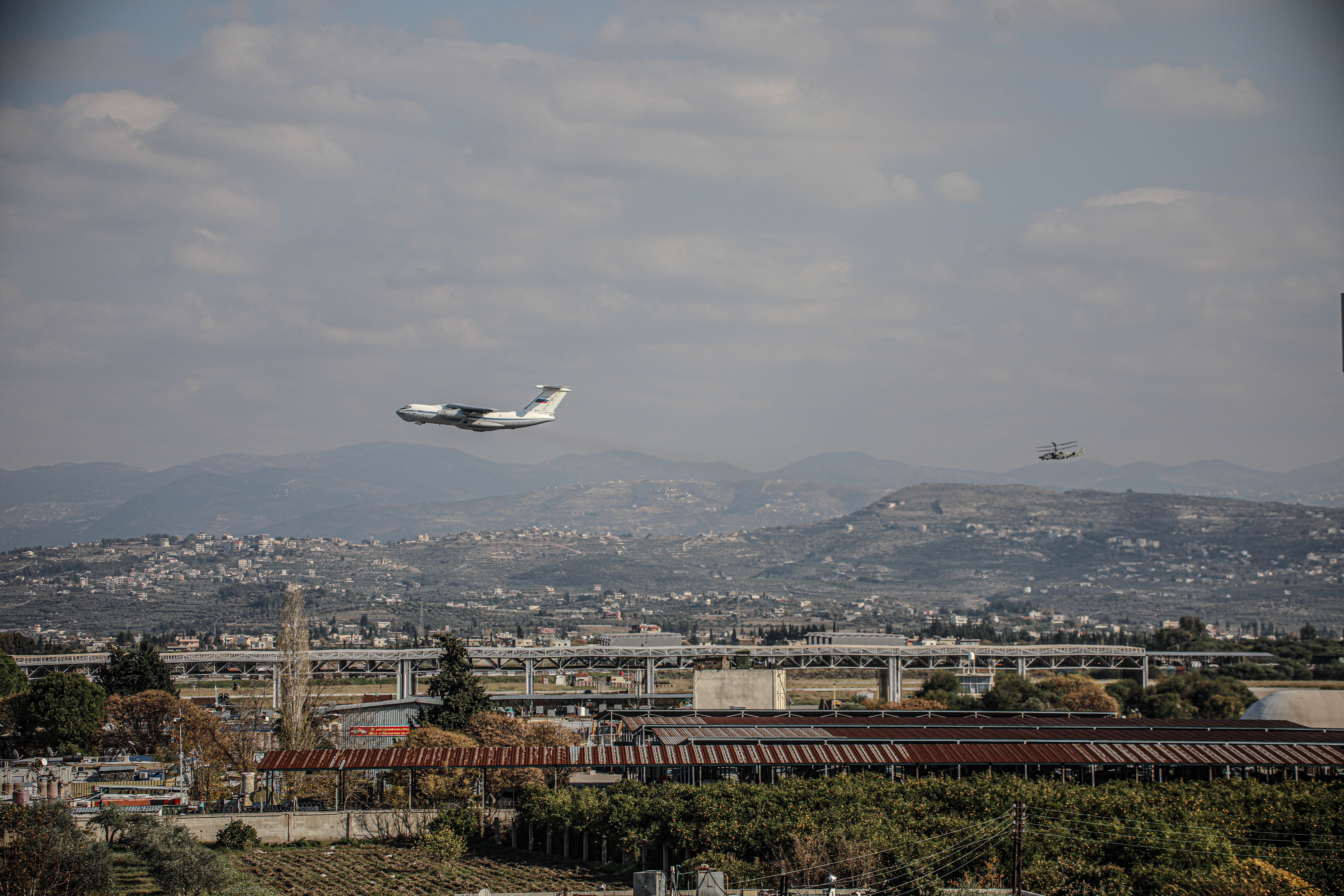 LATAKIA, SYRIA - DECEMBER 15: Military vehicles such as helicopters and planes along with surveillance balloons, belonging to the Russian troops, are seen entering the Russian Khmeimim Air Base in Jabla in Latakia, Syria on December 15, 2024. With the Baath regime's collapse, Russia continued to transfer its troops from Damascus, Homs and other cities across Syria to the base. (Photo by Izzettin Kasim/Anadolu via Getty Images)