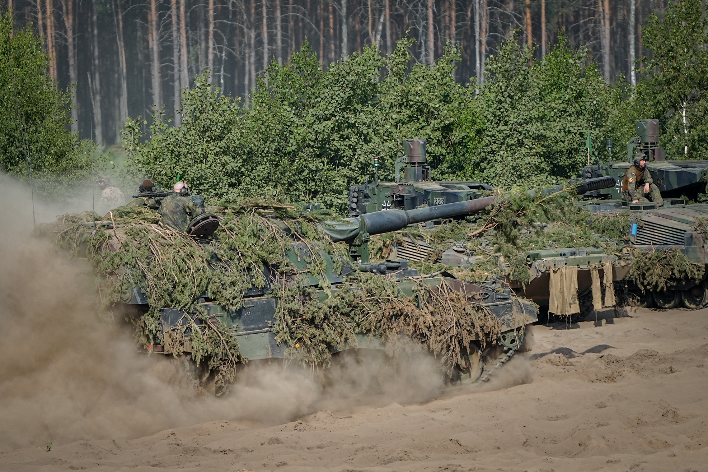 29 May 2024, Lithuania, Pabrade: Bundeswehr soldiers prepare for the conclusion of the NATO exercise Quadriga 2024 on the Panzerhaubitze 2000 and Puma main battle tank. At the Paprade military training area, the Bundeswehr is demonstrating the capabilities required to defend NATO's eastern flank. Quadriga is the German contribution to the large-scale NATO maneuver Steadfast Defender. Photo: Kay Nietfeld/dpa (Photo by Kay Nietfeld/picture alliance via Getty Images)