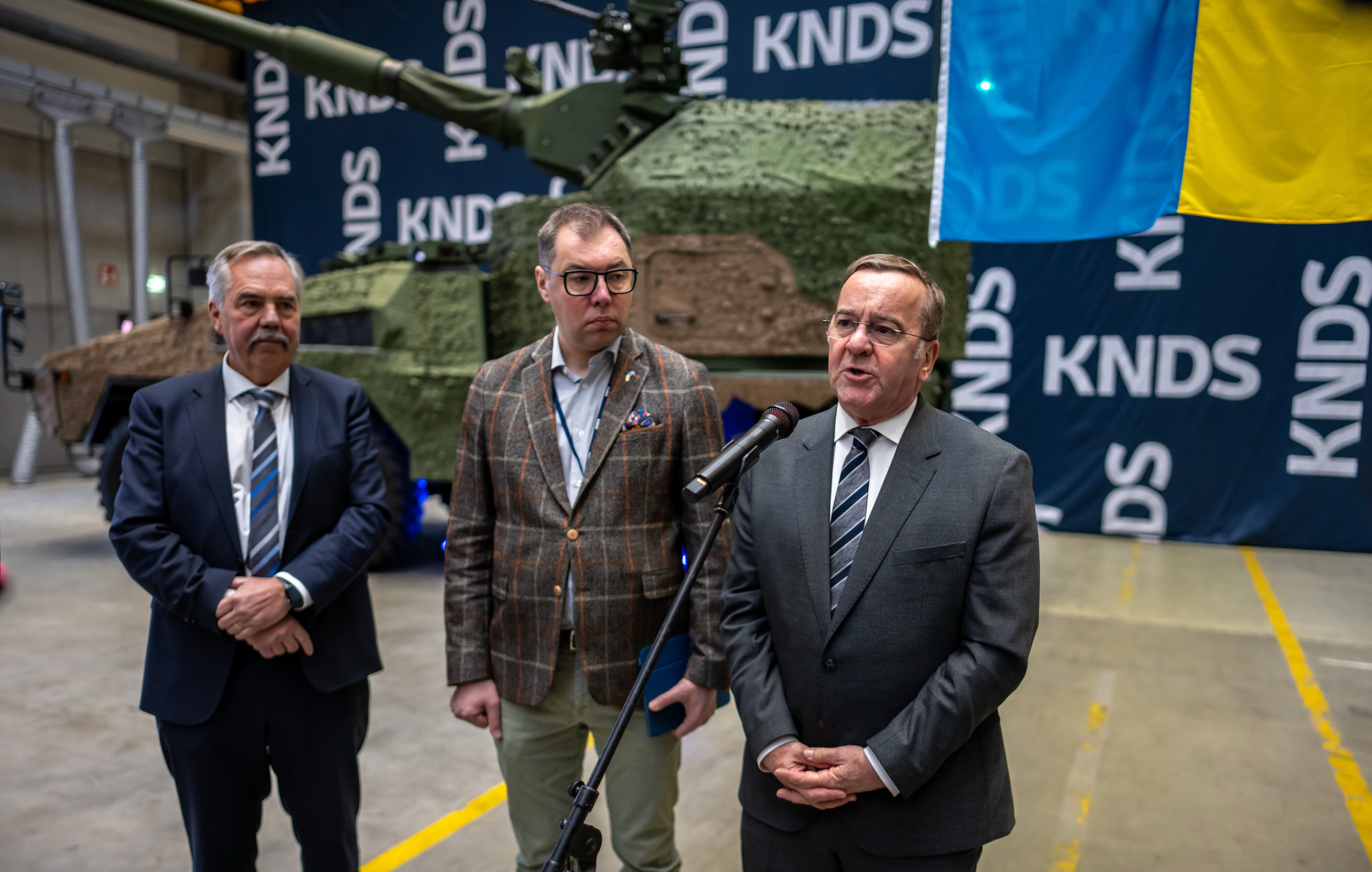 13 January 2025, Hesse, Kassel: Boris Pistorius (r-l SPD), Minister of Defense, stands next to Oleksii Makeiev, Ambassador of Ukraine and Ralf Ketzel, German head of the tank manufacturer KNDS, during a press statement after the handover of the first wheeled howitzer RCH 155 as weapons aid for Ukraine, in the production halls of the manufacturer, KNDS Deutschland GmbH & Co. KG. Photo: Michael Kappeler/dpa (Photo by Michael Kappeler/picture alliance via Getty Images)