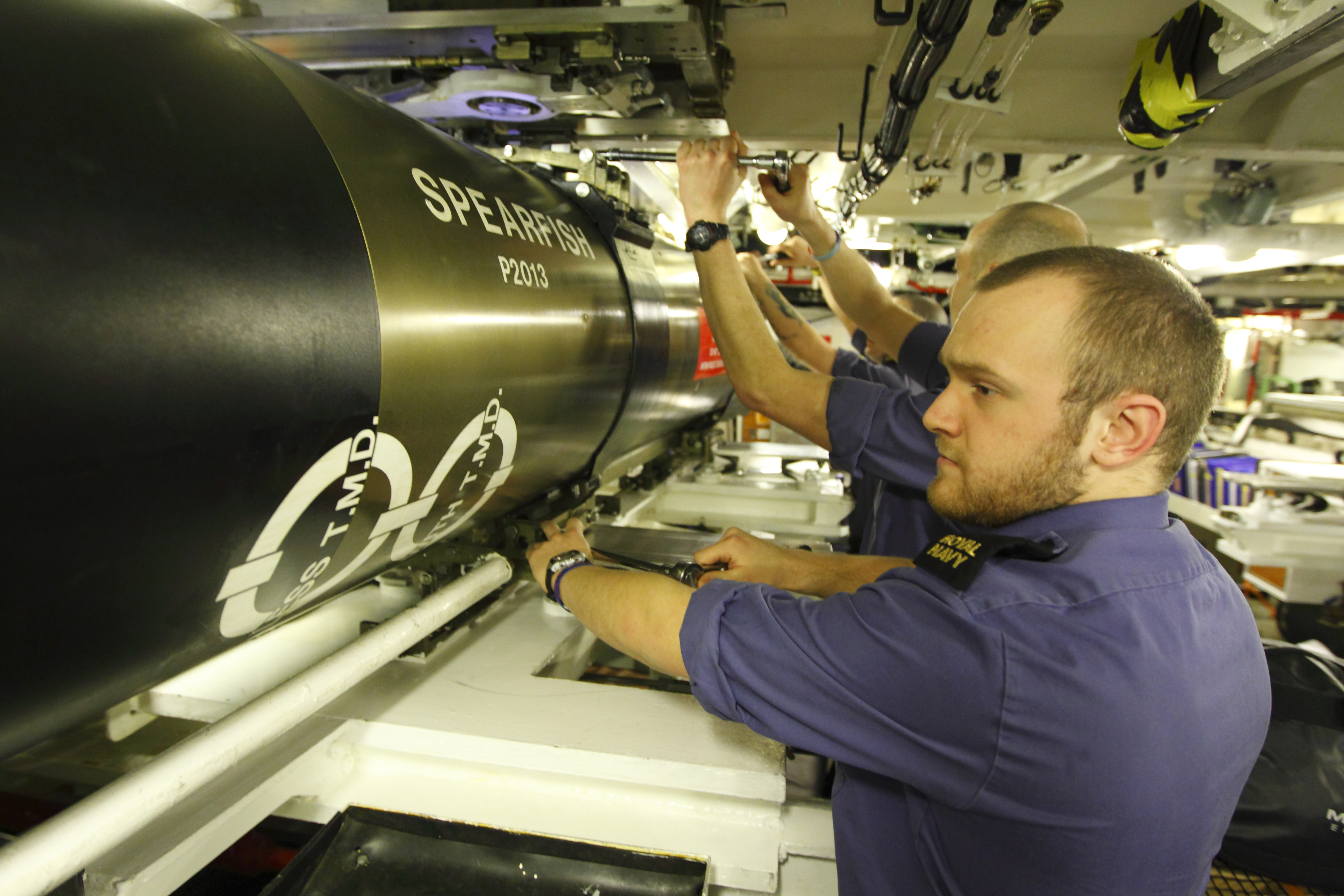 Submariners check a Spearfish torpedo in the 'bomb shop' aboard the Royal Navy nuclear submarine HMS Tireless after arriving in Southampton for a five day visit. (Photo by Chris Ison/PA Images via Getty Images)