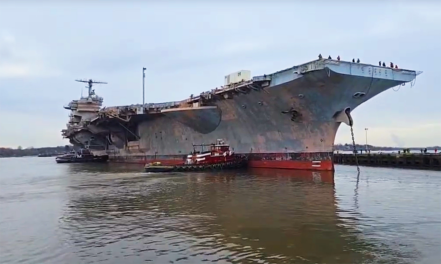 The ex-USS John F. Kennedy left Philadelphia today for a journey to a Texas scrapyard
