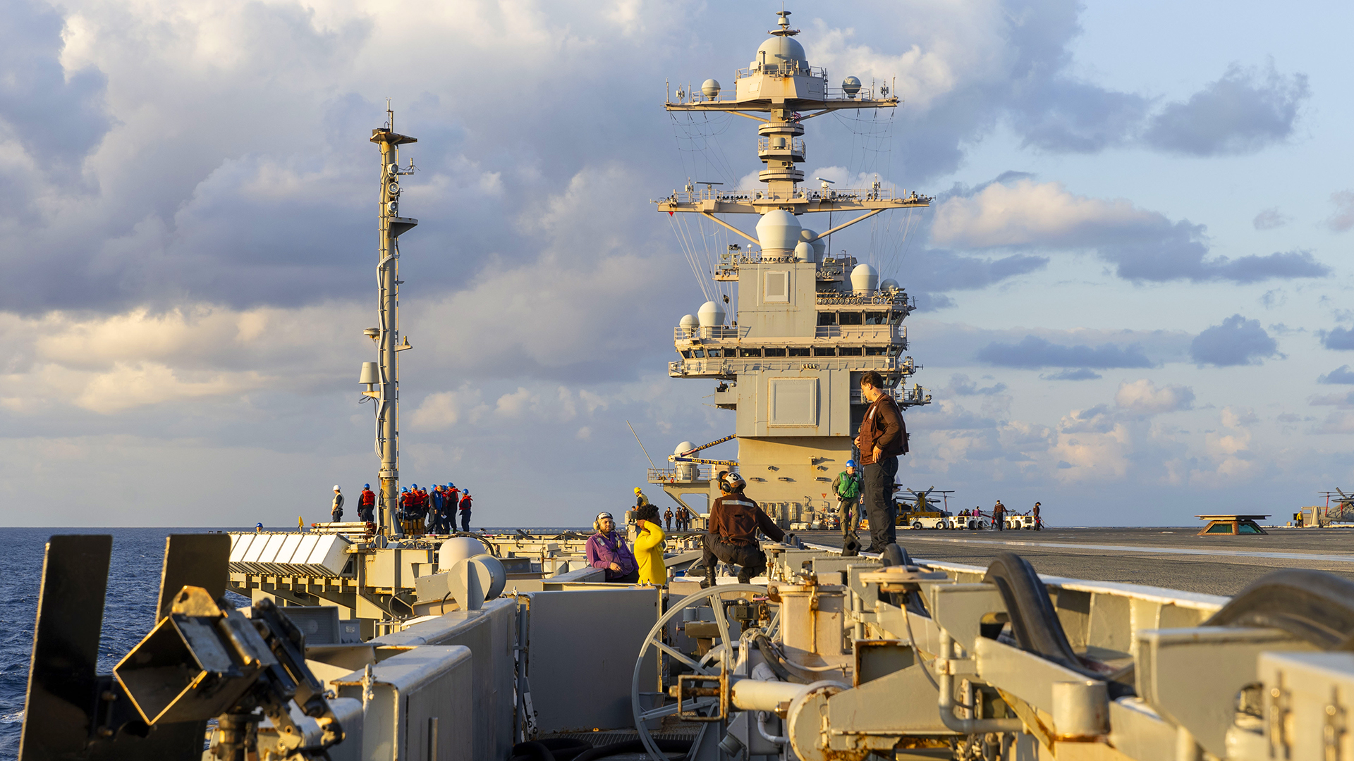 ATLANTIC OCEAN (OCT. 22, 2024) Sailors stand by for a fueling at sea (FAS) evolution aboard the world’s largest aircraft carrier, USS Gerald R. Ford (CVN78), October 22, 2024. USS Gerald R. Ford, the flagship of the Gerald R. Ford Carrier Strike Group, is currently underway in the U.S. 2nd Fleet area of operations, conducting Surface Warfare Advanced Tactical training (SWATT). SWATT is the surface force’s premiere advanced tactical training exercise that increases war fighting capability and tactical proficiency across all domains. (U.S. Navy Photo by Mass Communication Specialist Seaman Brianna Barnett)