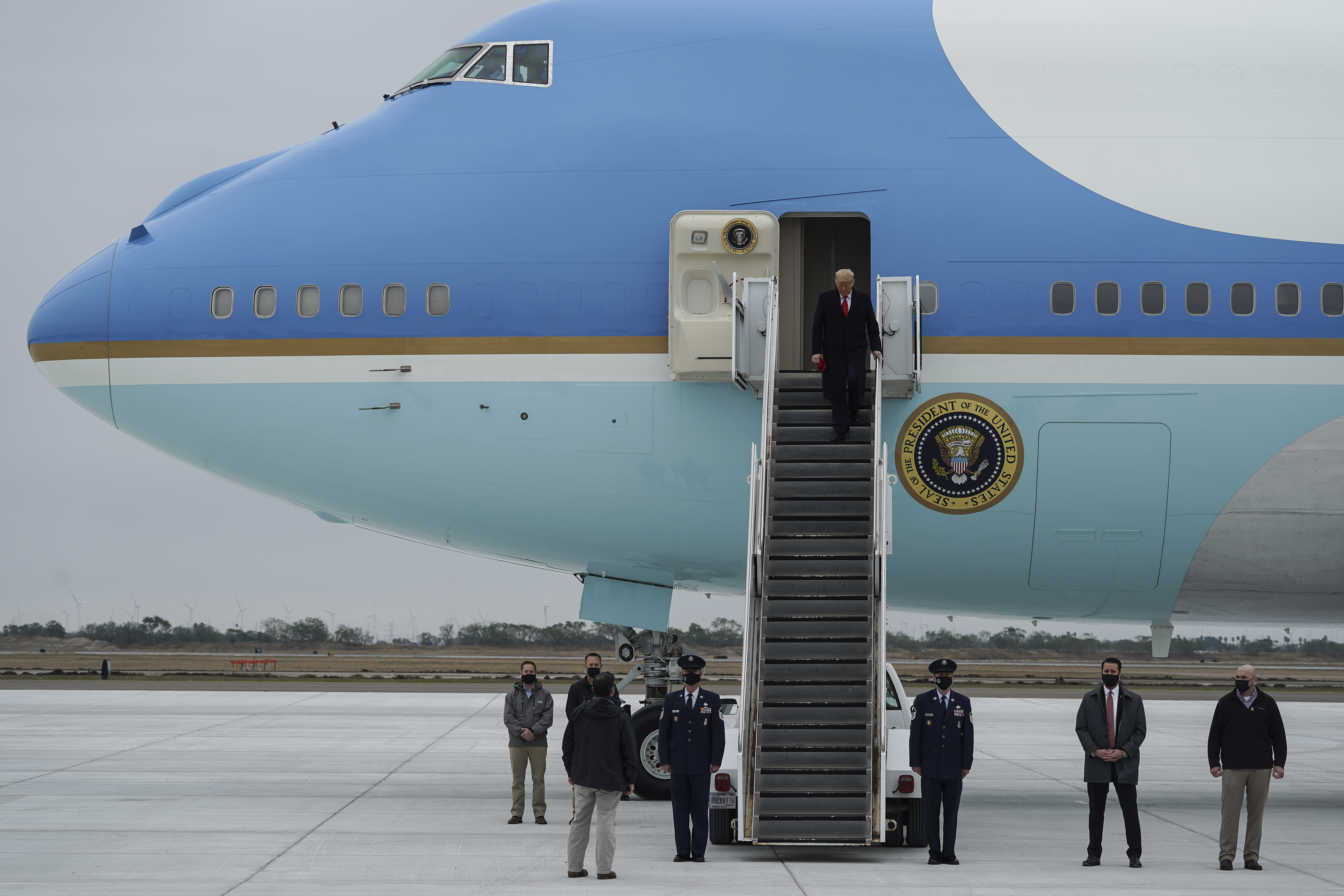 HARLINGEN, TX - JANUARY 12: President Donald Trump walks down the stairs as he exits Air Force One at Valley International Airport on January 12, 2021 in Harlingen, Texas. President Trump later delivered remarks during a visit to the U.S.-Mexico Border in Alamo, Texas. (Photo by Go Nakamura/Getty Images)