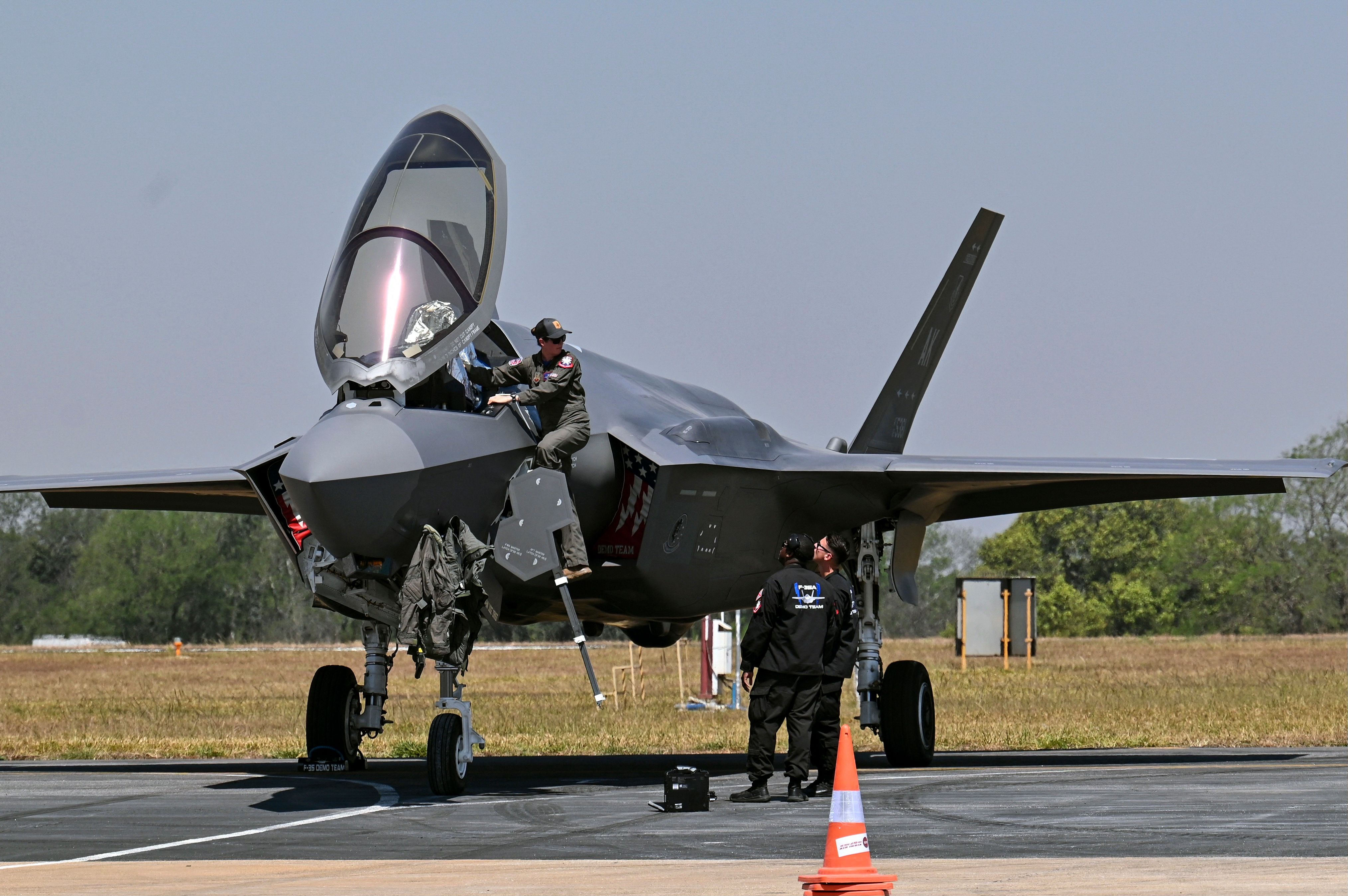 A pilot climbs into the cockpit of US Air Force's (USAF) fifth-generation supersonic multirole F-35 fighter jet on the second day of the 14th edition of Aero India 2023 at the Yelahanka Air Force Station in Bengaluru on February 14, 2023. (Photo by Manjunath KIRAN / AFP) (Photo by MANJUNATH KIRAN/AFP via Getty Images)