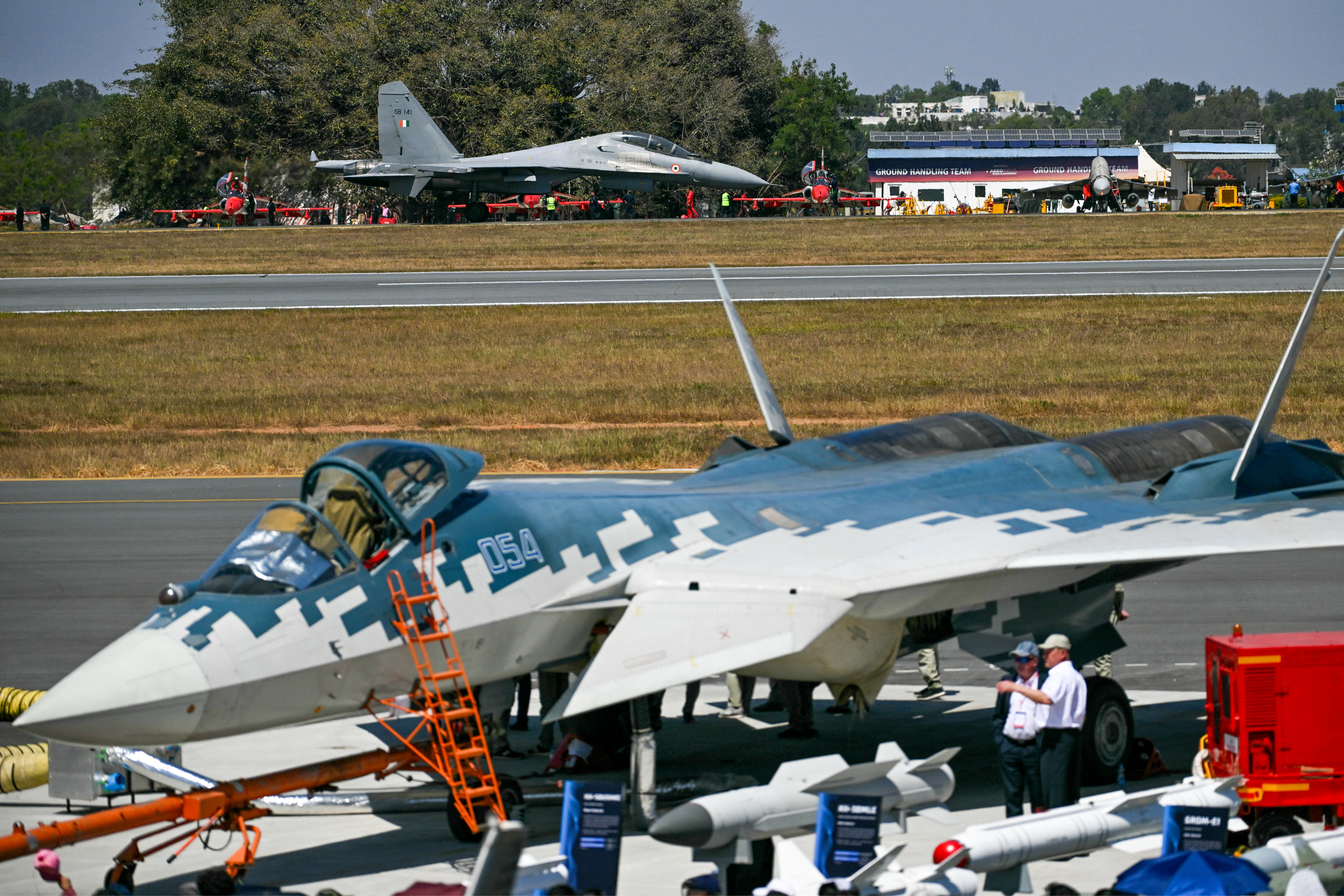 The Indian Air Force (IAF) Sukhoi Su-30MKI fighter jet lands at the tarmac during Aero India 2025, a military aviation exhibition at the Yelahanka Air Force Station in Bengaluru on February 11, 2025. Air traffic is booming in India, even though only a tiny fraction of its people fly each year, and manufacturers are seeking lucrative deals at the flagship Aero India exhibition from February 10. (Photo by Arun SANKAR / AFP) (Photo by ARUN SANKAR/AFP via Getty Images)