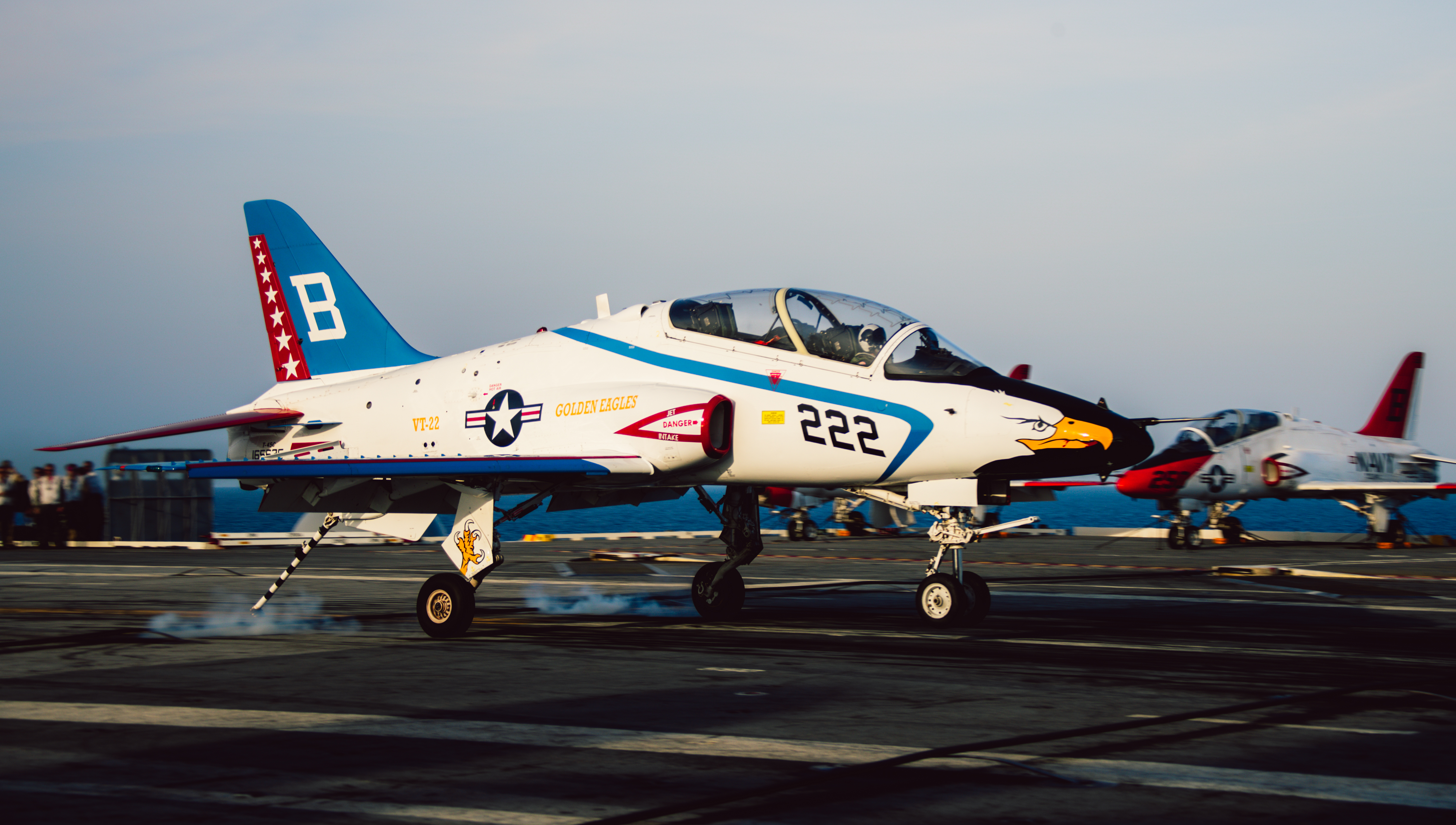 A T-45C Goshawk training aircraft, assigned to Training Squadron (VT) 22 lands on the flight deck of Nimitz-class aircraft carrier USS George Washington (CVN 73) during flight operations in the Atlantic Ocean, Aug. 8, 2023. George Washington is underway in support of carrier qualifications. (U.S. Navy photo by Mass Communication Specialist Seaman August Clawson)