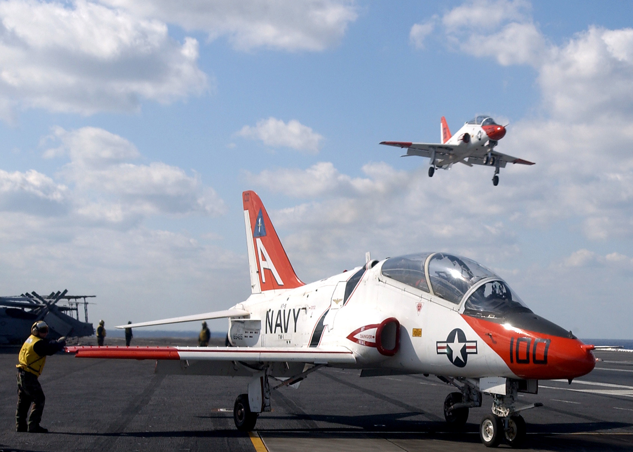 A T-45 Goshawk training aircraft is waved off from making an arrested landing aboard the aircraft carrier USS Theodore Roosevelt. The T-45 is used for intermediate and advanced portions of the Navy and Marine Corps pilot training program for jet carrier aviation and tactical strike missions. Roosevelt is conducting carrier qualifications in the Atlantic Ocean.