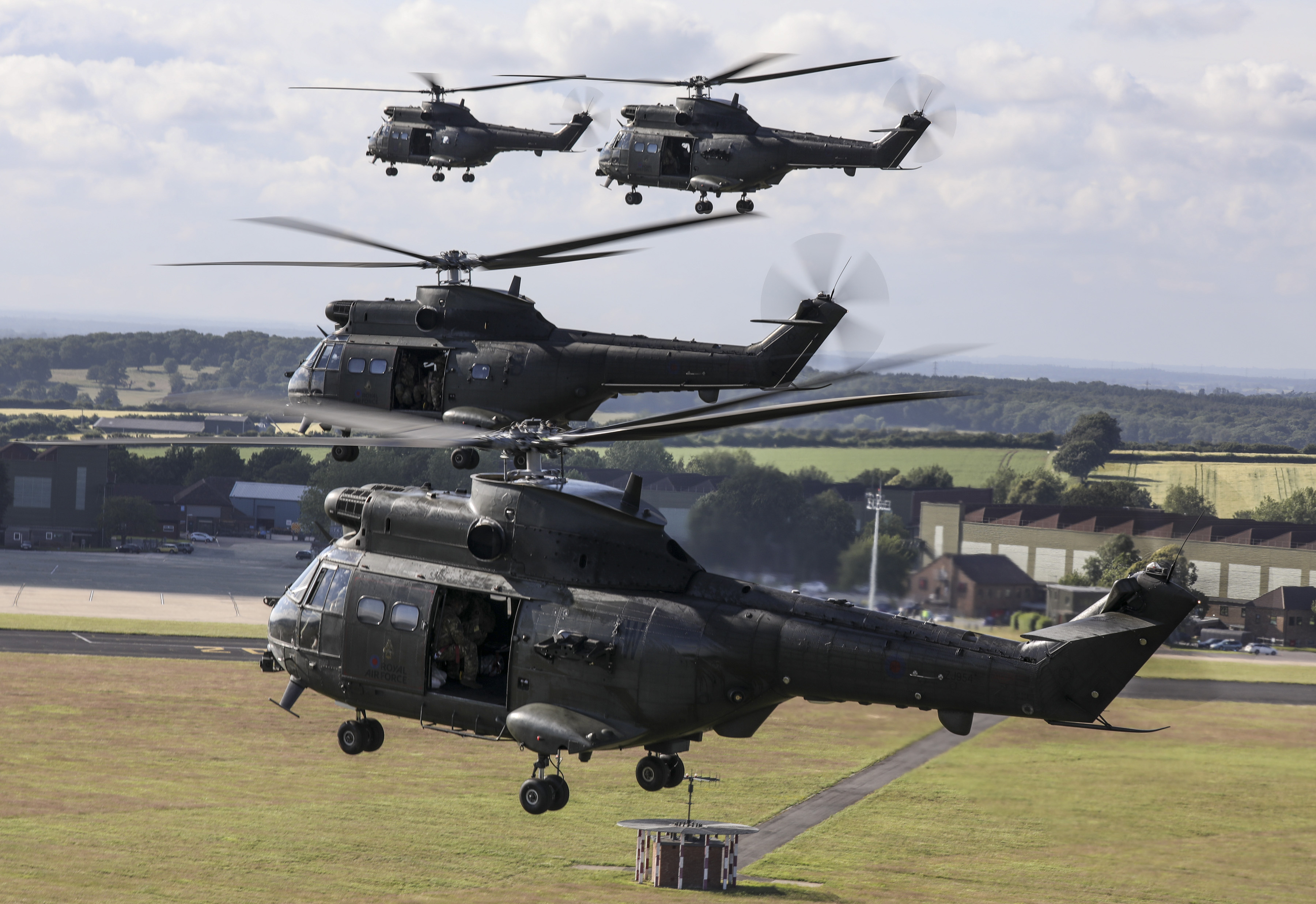 “A Moment in Time” A formation of 10 Puma helicopters departed RAF Benson on 7th July 2021 as part of a training sortie that incorporated flypasts of notable locations for the Puma Force over the past 50 years. Pictured here are four of hte Puma’s leaving an RAF Base. This included those that hold historical significance as well as those that provide support to delivering current Puma operational capability. The helicopters have also supported UK resilience such as providing a helicopter lift capability to flood relief efforts and more recently the COVID-19 response. Based at Kinloss Barracks, the Pumas deployed at short notice in the early stages of the pandemic to provide vital transport for personnel and equipment in Scotland and Northern England, as well as being on standby 24/7 to support any task required in the UK. Group Captain Nick Paton, the Puma Force Commander and Station Commander at RAF Benson, said: “Since the Puma first came into service in 1971, it has successfully contributed to operations and humanitarian missions around the globe. Today is a poignant day for all who have served and continue to serve on the Puma Force as we mark 50 years of outstanding service. The commitment and professionalism of the whole team, whether aircrew, engineers, or support staff, has been exceptional. They deserve to be proud of everything they have achieved together over the past five decades.”
